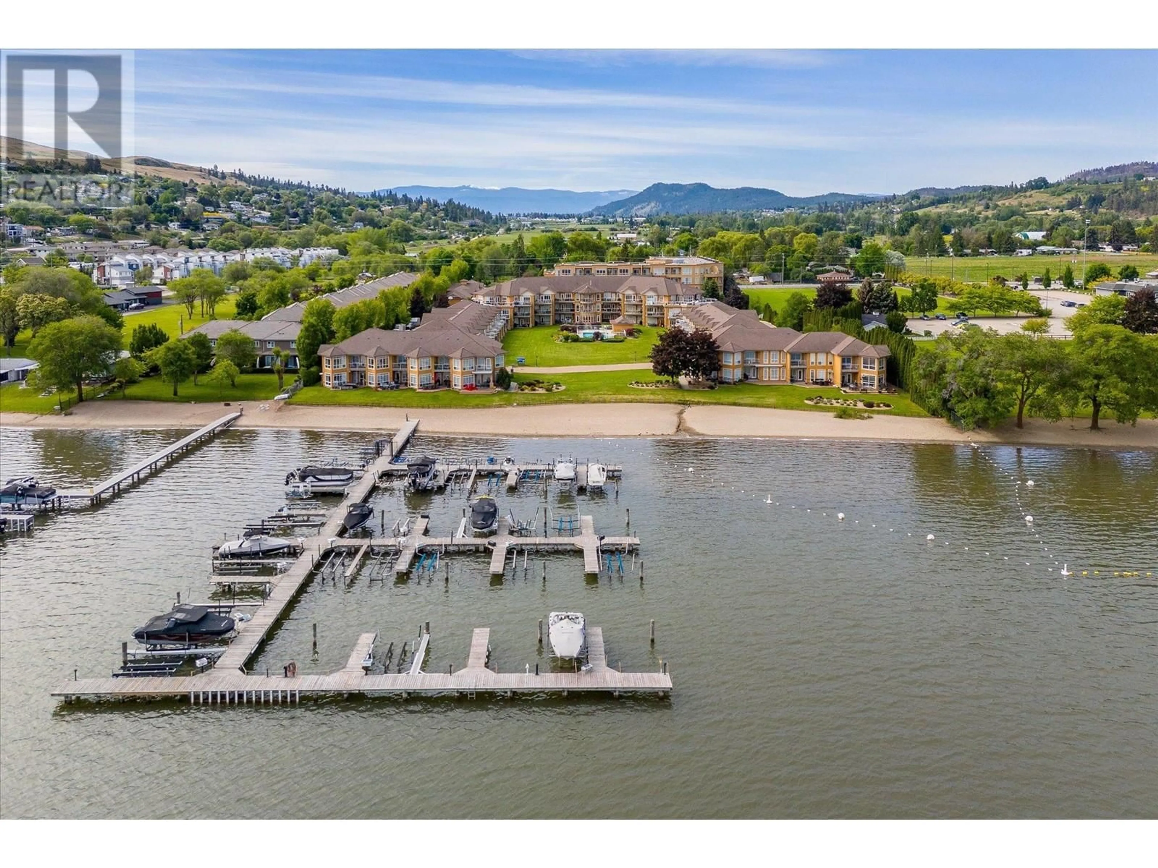 A pic from outside/outdoor area/front of a property/back of a property/a pic from drone, water/lake/river/ocean view for 105 - 3570 WOODSDALE ROAD, Lake Country British Columbia V4V1Y9