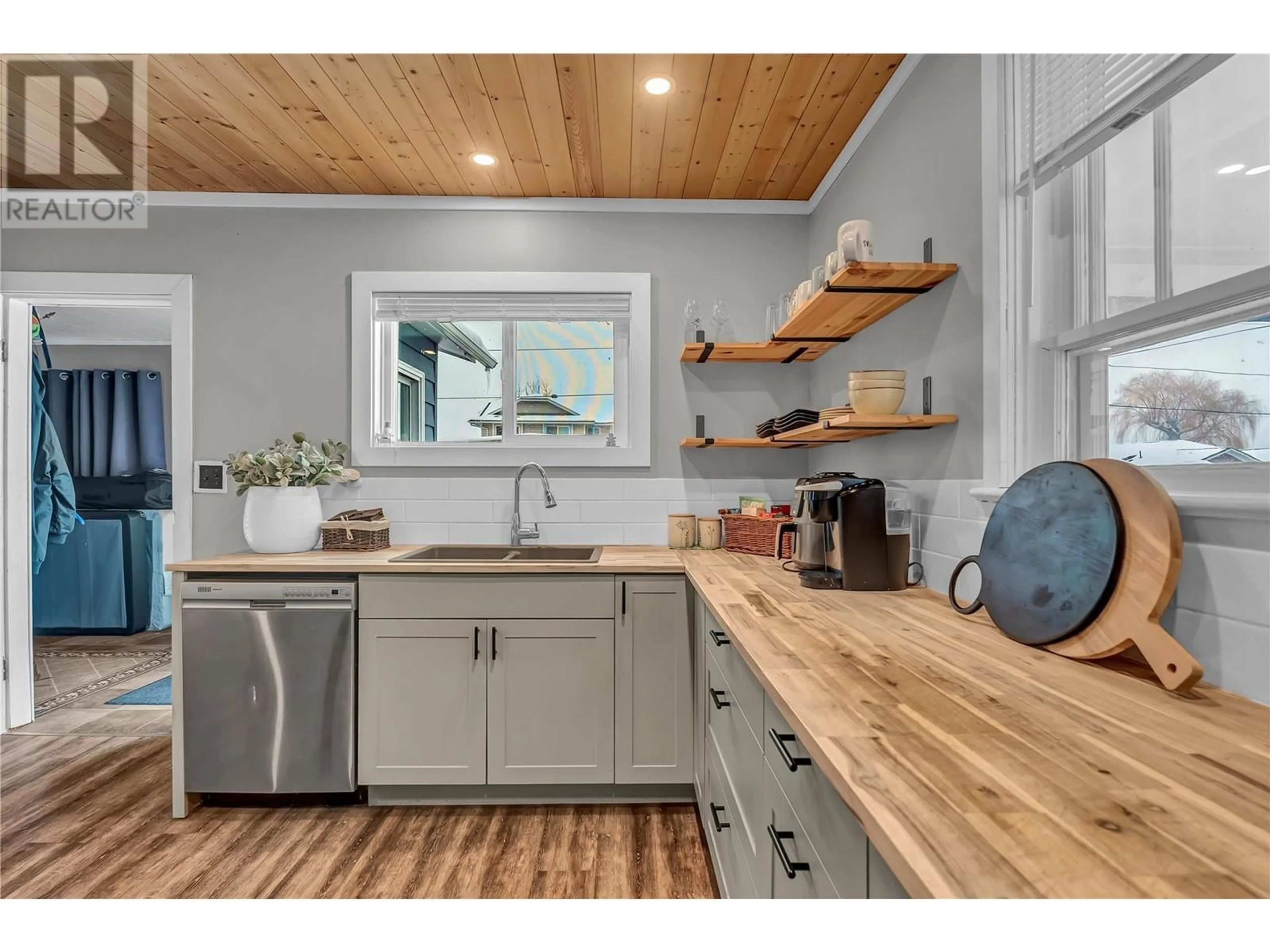 Open concept kitchen, wood/laminate floor for 11406 VICTORIA Road S, Summerland British Columbia V0H1Z2