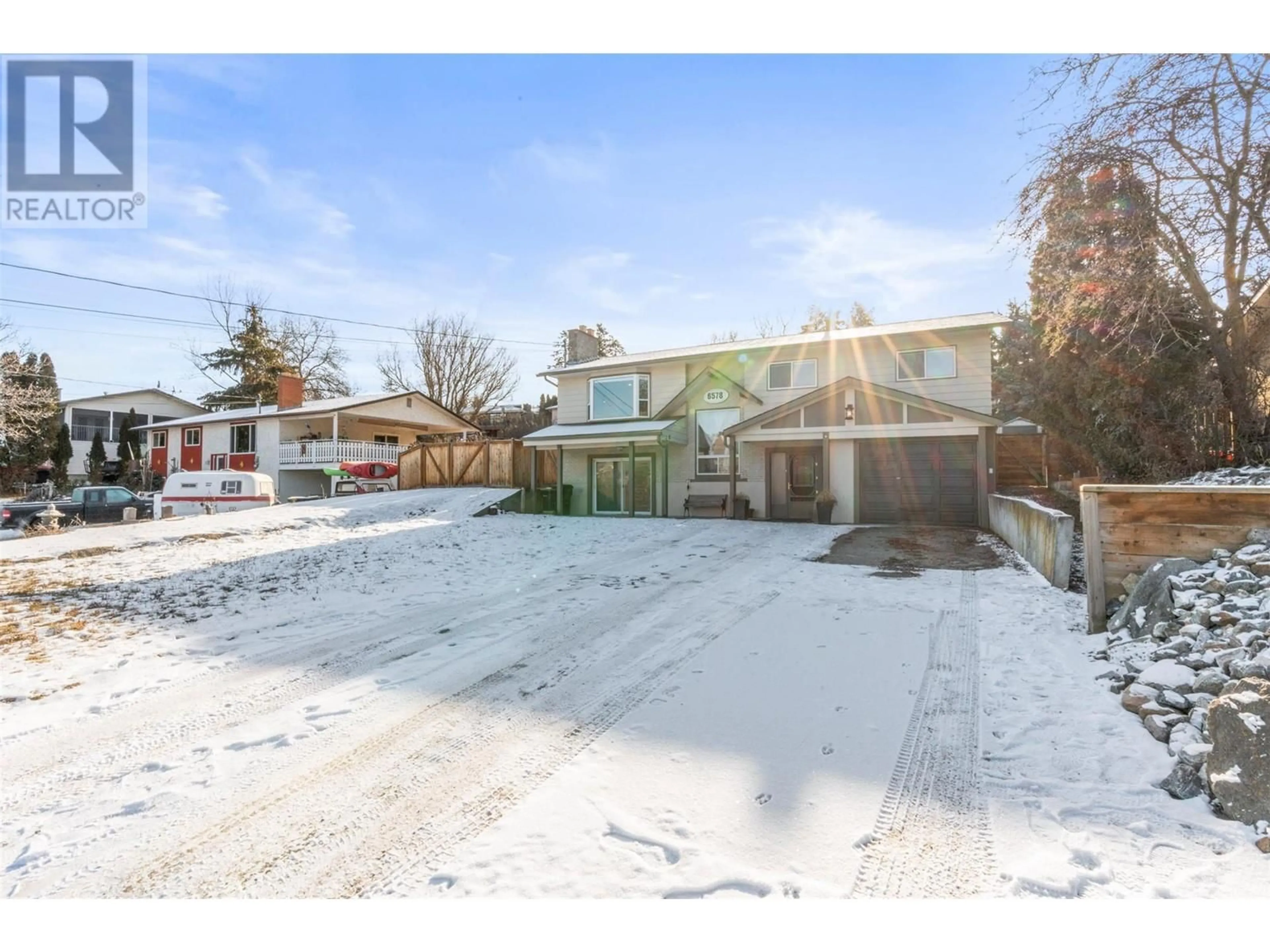 A pic from outside/outdoor area/front of a property/back of a property/a pic from drone, street for 6578 Longacre Drive, Vernon British Columbia V1H1H9