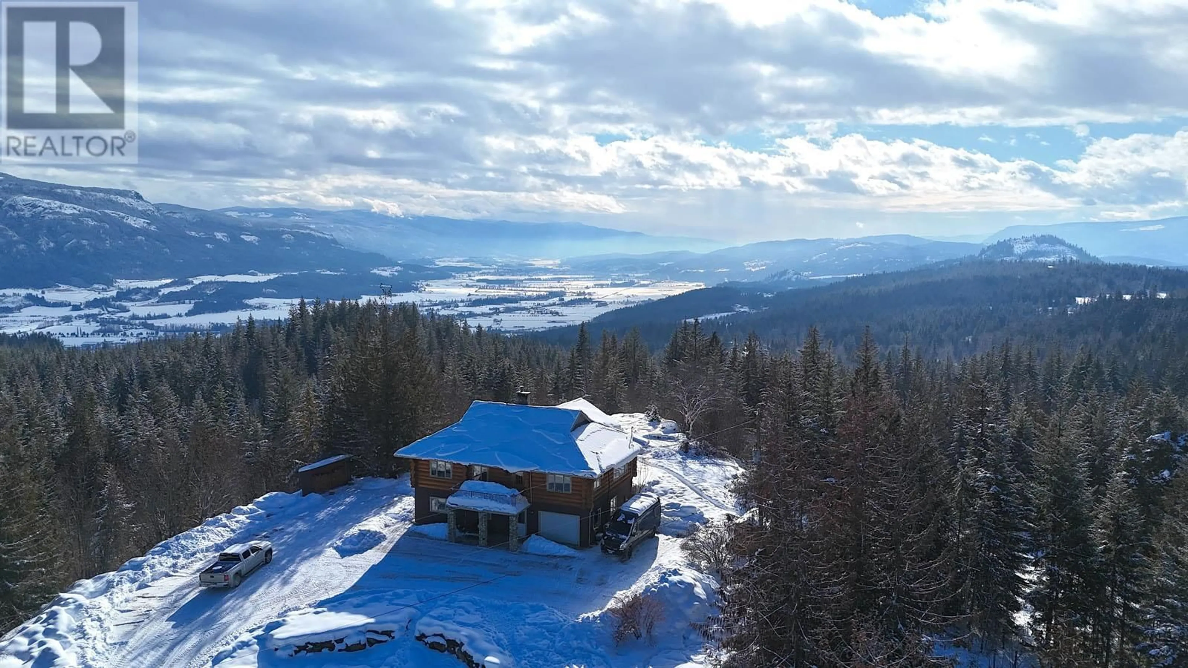 A pic from outside/outdoor area/front of a property/back of a property/a pic from drone, mountain view for 141 EDGAR ROAD, Salmon Arm British Columbia V1E2Y2
