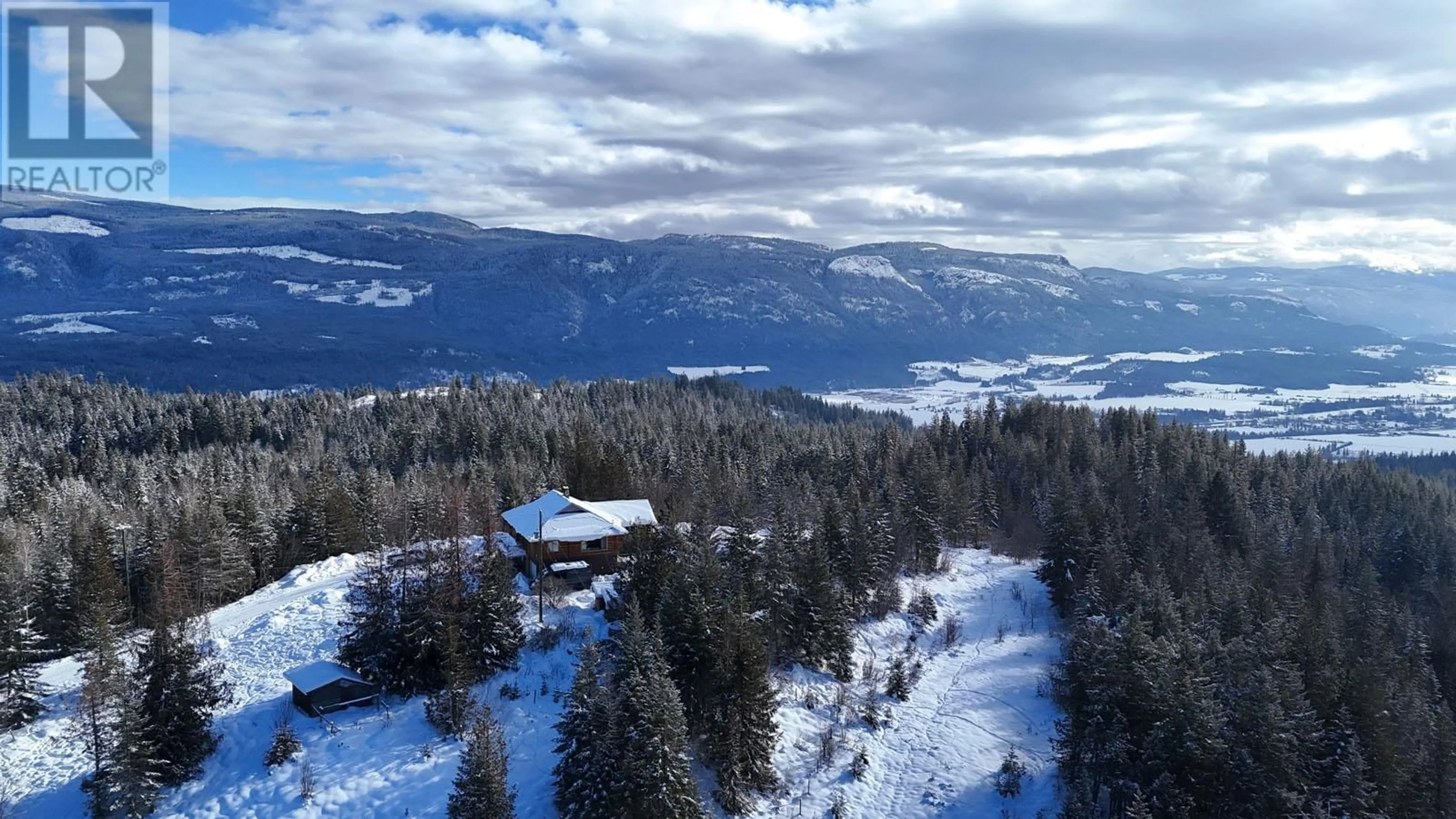 A pic from outside/outdoor area/front of a property/back of a property/a pic from drone, mountain view for 141 EDGAR ROAD, Salmon Arm British Columbia V1E2Y2