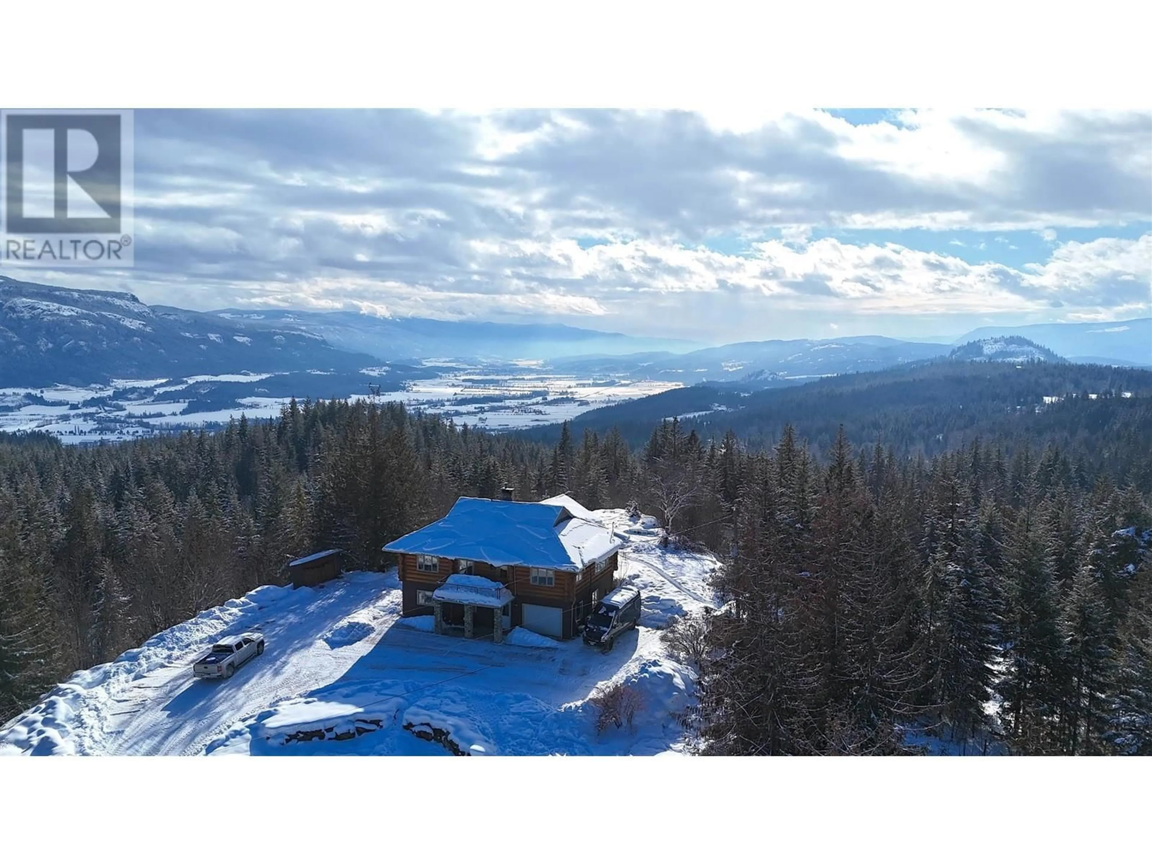 A pic from outside/outdoor area/front of a property/back of a property/a pic from drone, mountain view for 141 Edgar Road, Salmon Arm British Columbia V1E2Y2