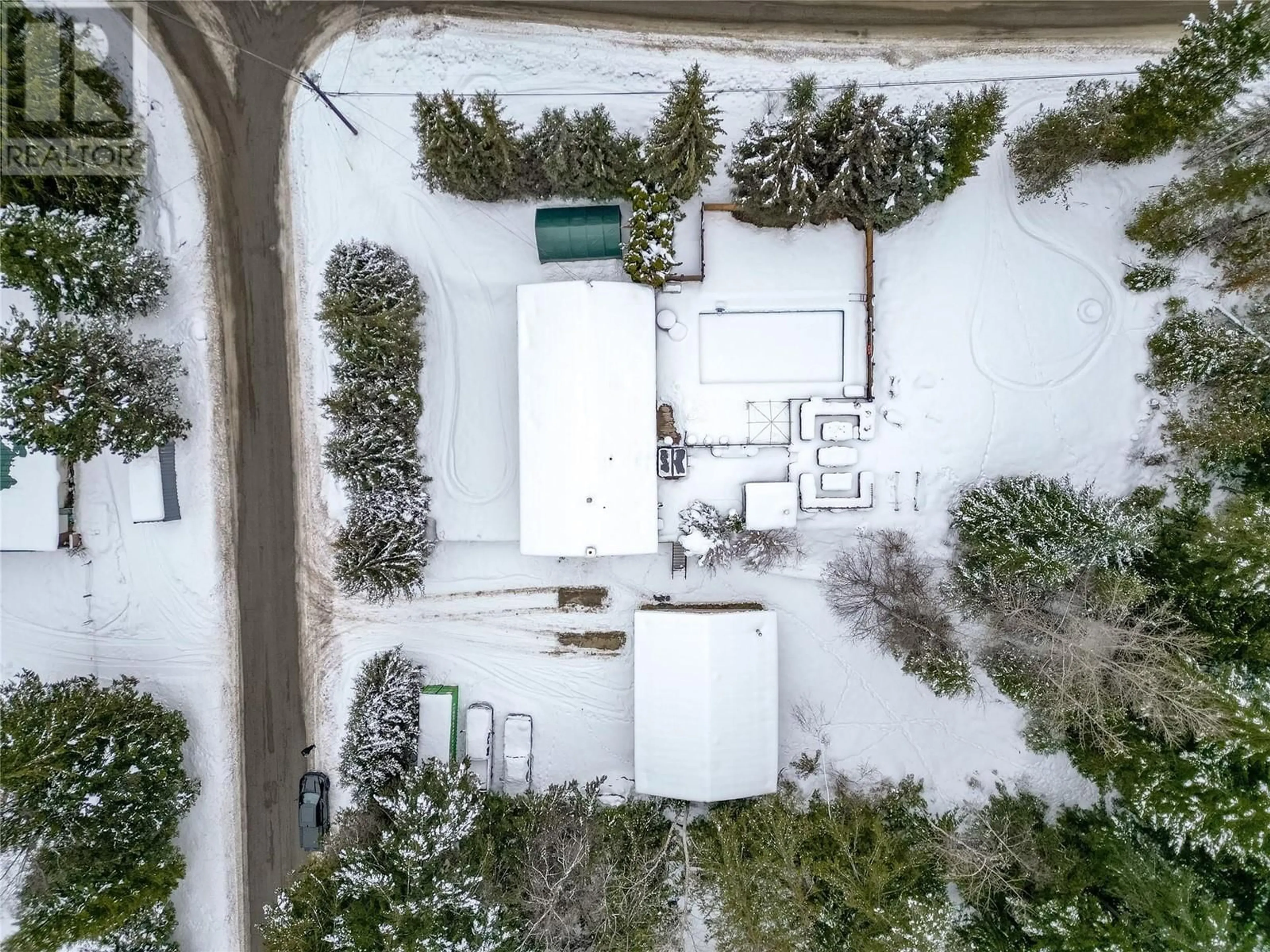 A pic from outside/outdoor area/front of a property/back of a property/a pic from drone, street for 5247 Mayfair Road SE, Salmon Arm British Columbia V1E2P8