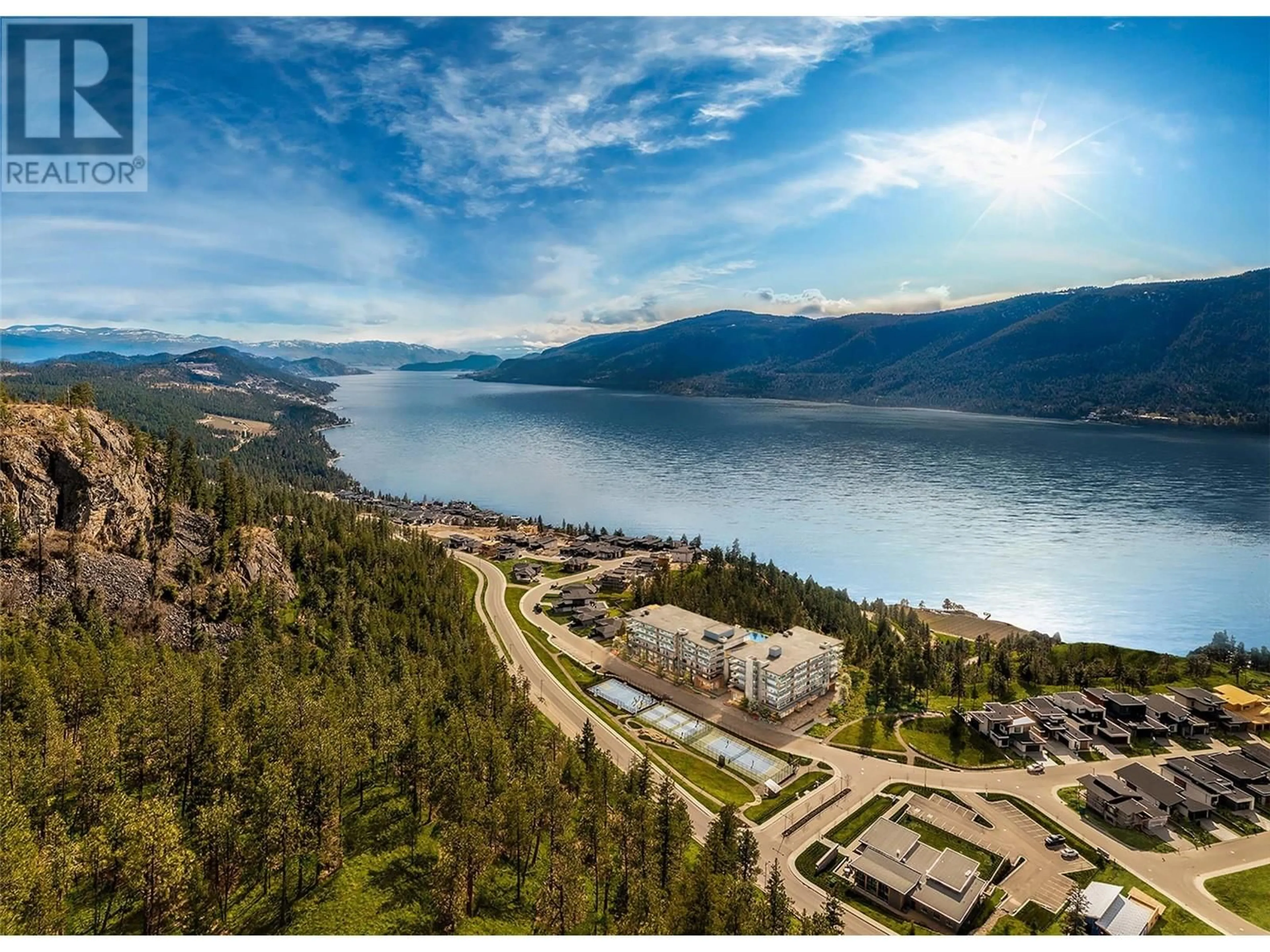 A pic from outside/outdoor area/front of a property/back of a property/a pic from drone, water/lake/river/ocean view for 204 - 9654 BENCHLAND DRIVE, Lake Country British Columbia V4V1N3