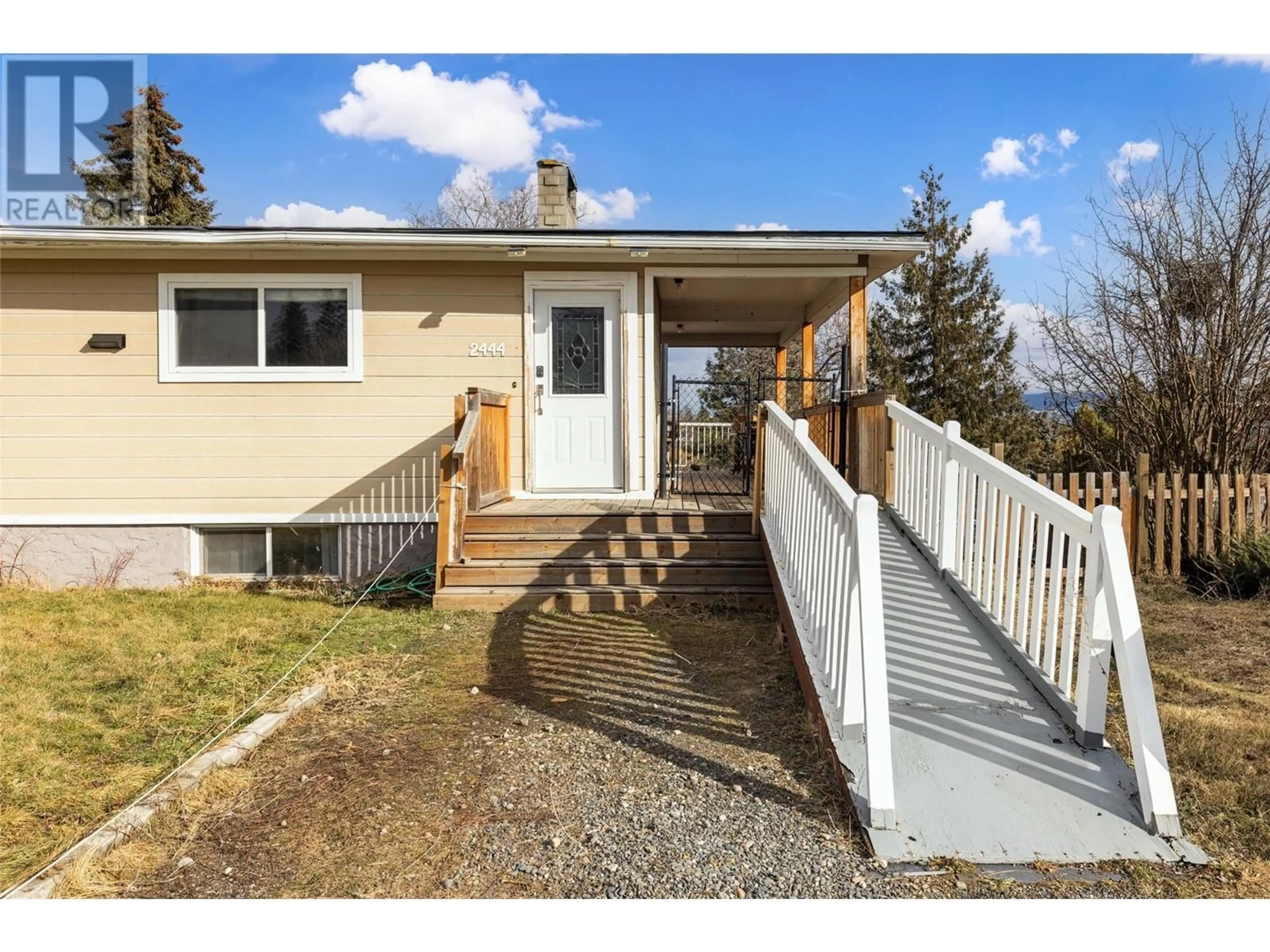 Home with vinyl exterior material, street for 2444 Orlin Road, West Kelowna British Columbia V4T1N2