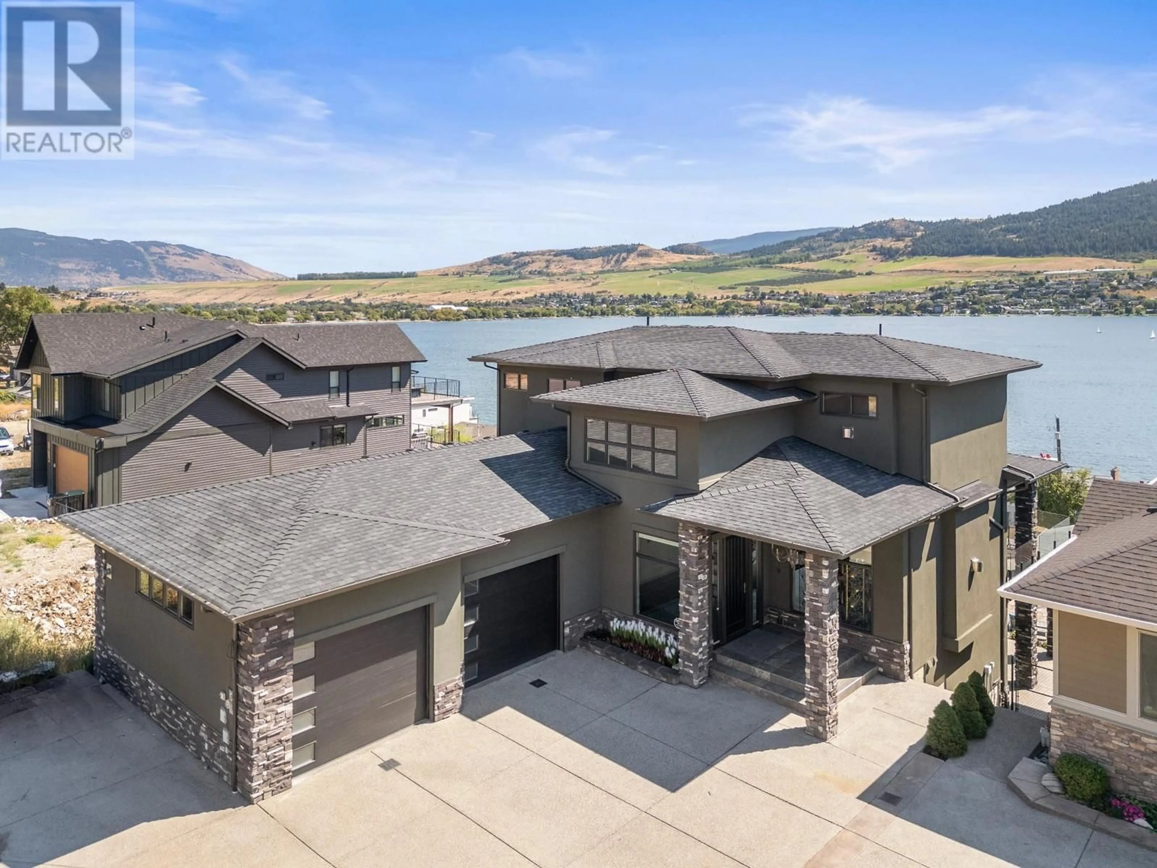 A pic from outside/outdoor area/front of a property/back of a property/a pic from drone, water/lake/river/ocean view for 7486 Tronson Road, Vernon British Columbia V1H1C3