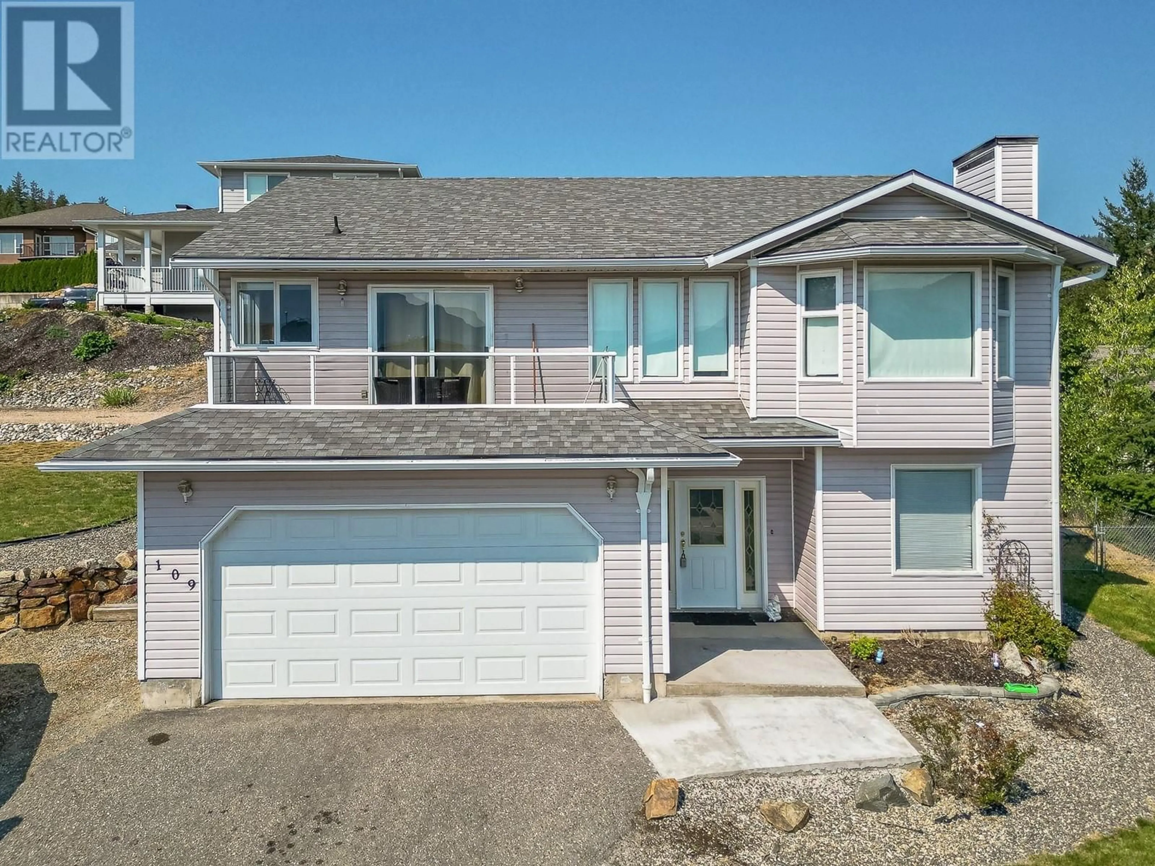 Home with vinyl exterior material, street for 109 RESERVOIR ROAD, Enderby British Columbia V0E1V1