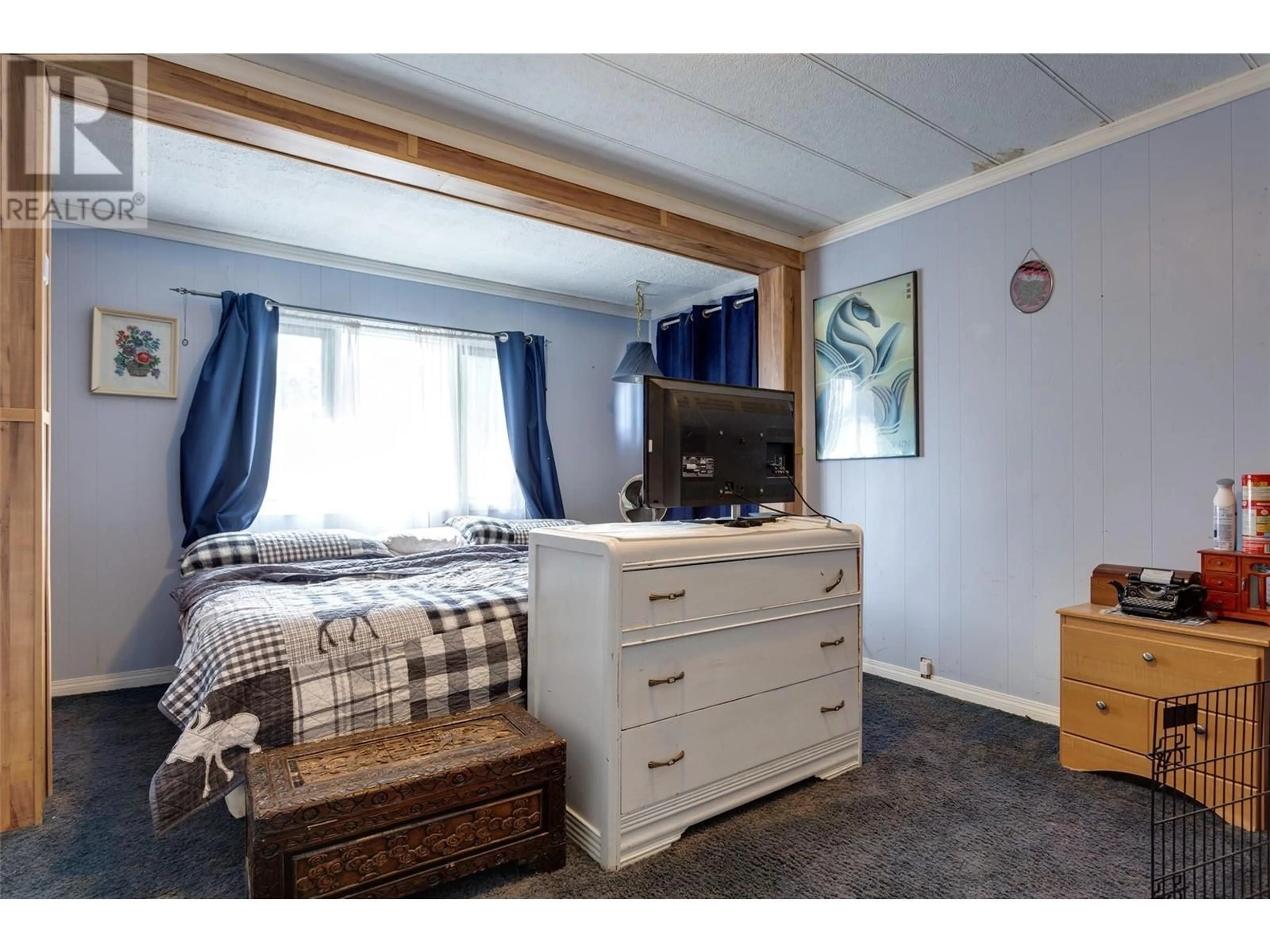 Bedroom with bed, wood/laminate floor for 1375 Green Bay Road Unit# 12A, West Kelowna British Columbia V4T2B8