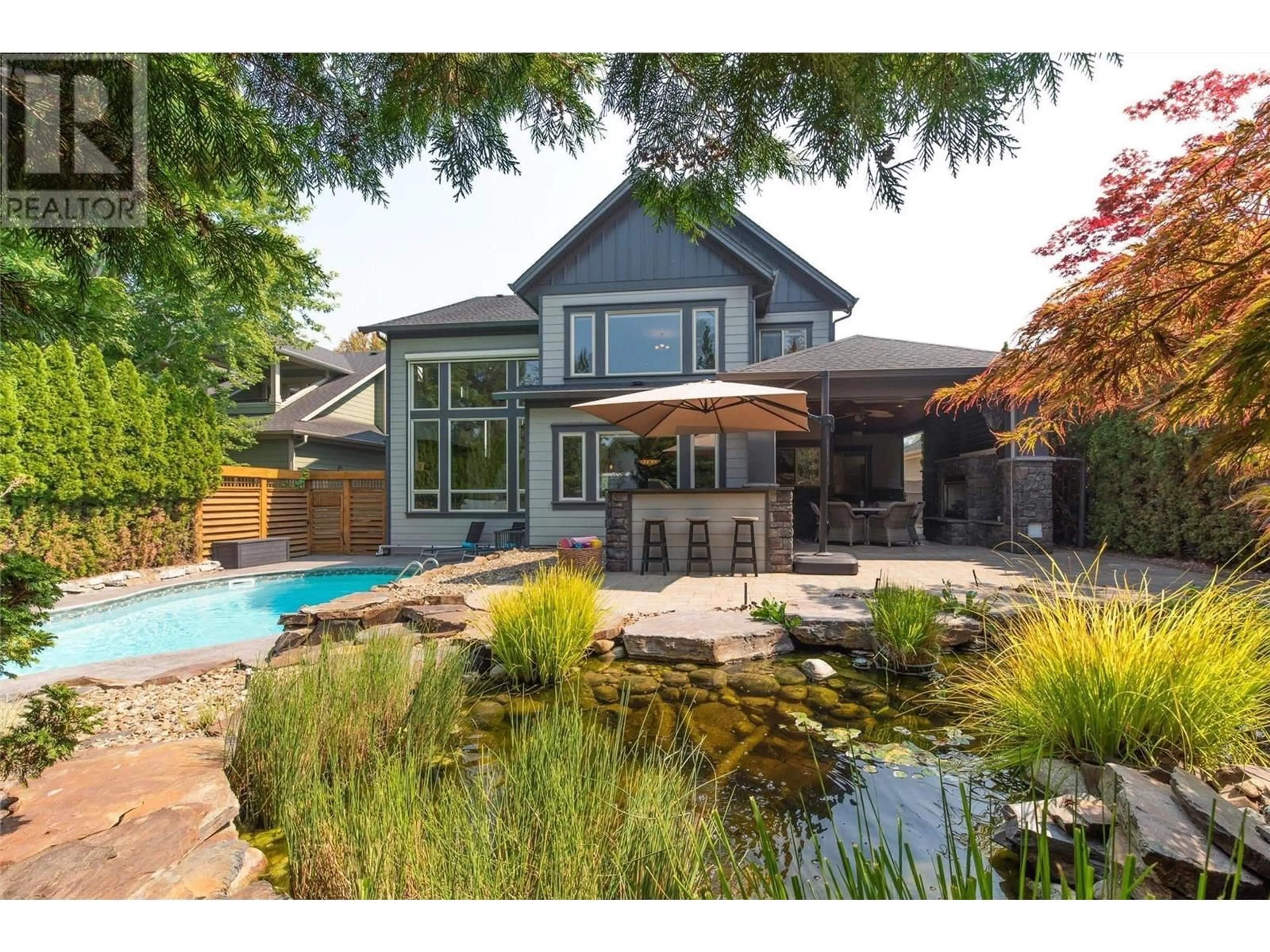 Home with brick exterior material, water/lake/river/ocean view for 344 Quilchena Drive, Kelowna British Columbia V1W4W4