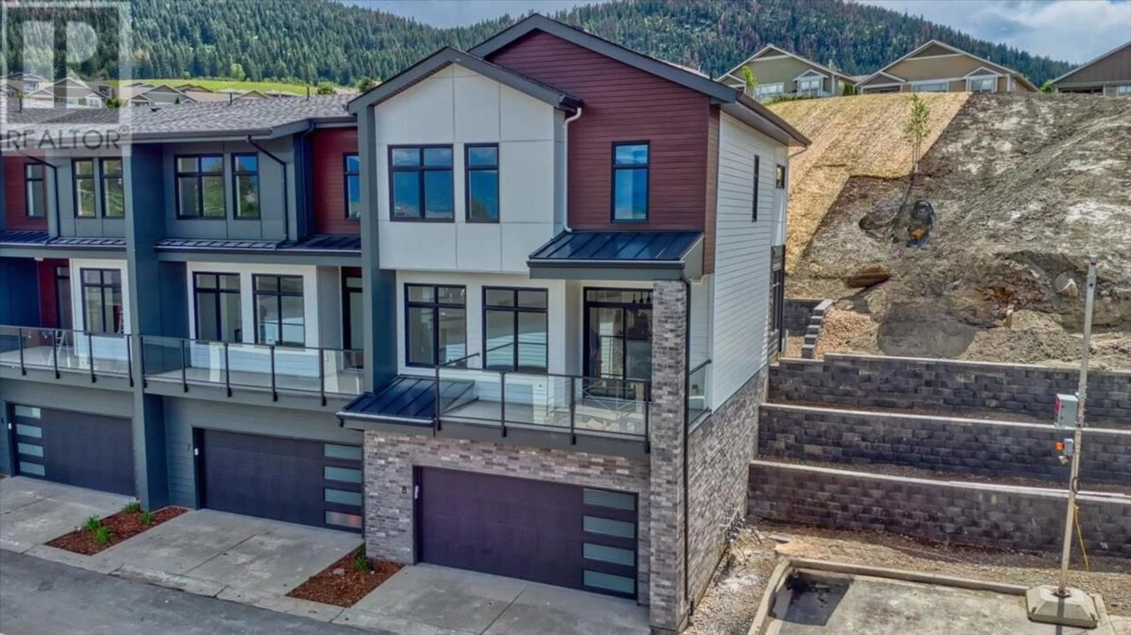 A pic from outside/outdoor area/front of a property/back of a property/a pic from drone, mountain view for 8 - 7599 KLINGER ROAD, Vernon British Columbia V1H1H4