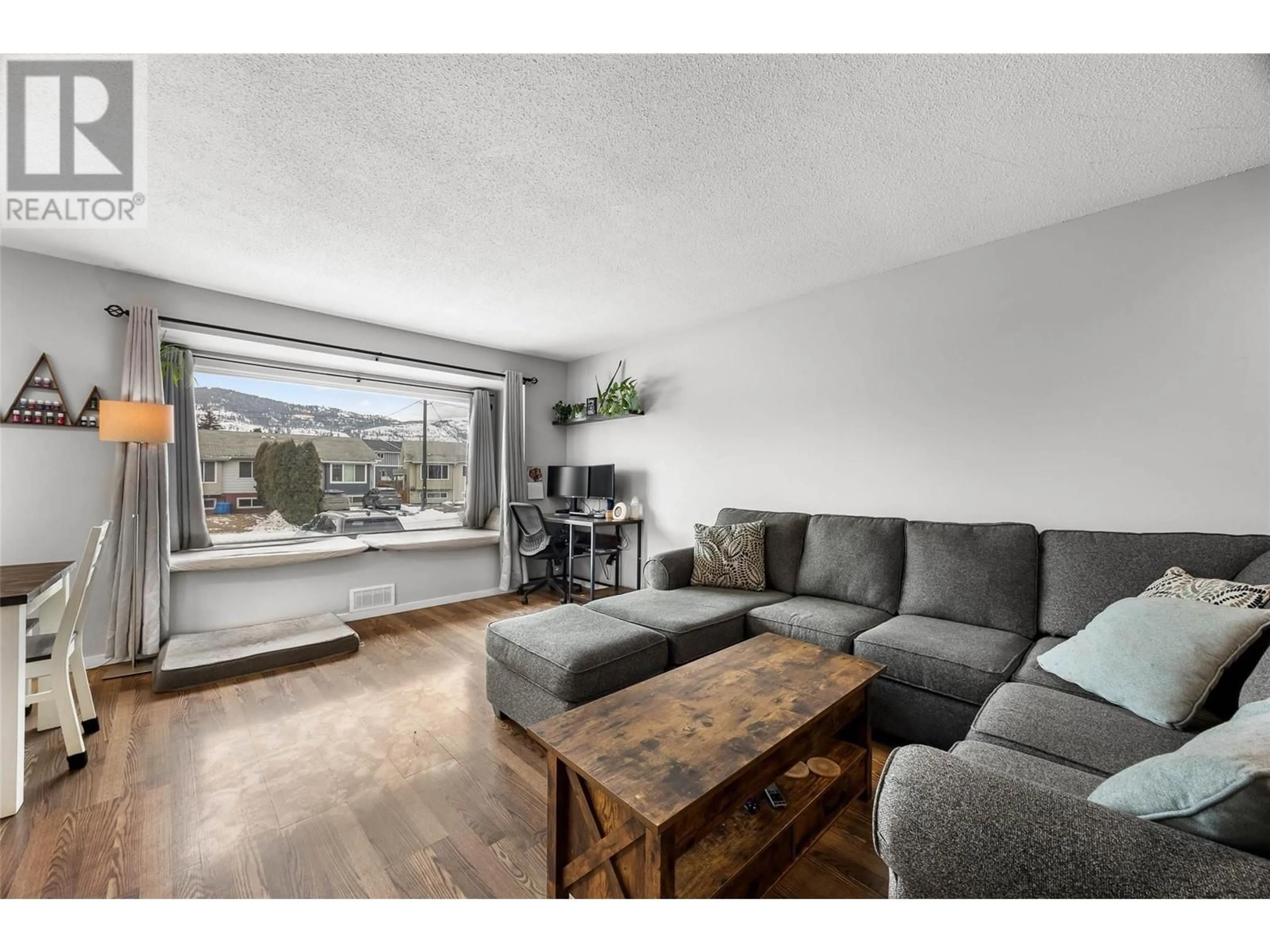 Living room with furniture, wood/laminate floor for 1634 Spartan Place, Kamloops British Columbia V2B7Z3