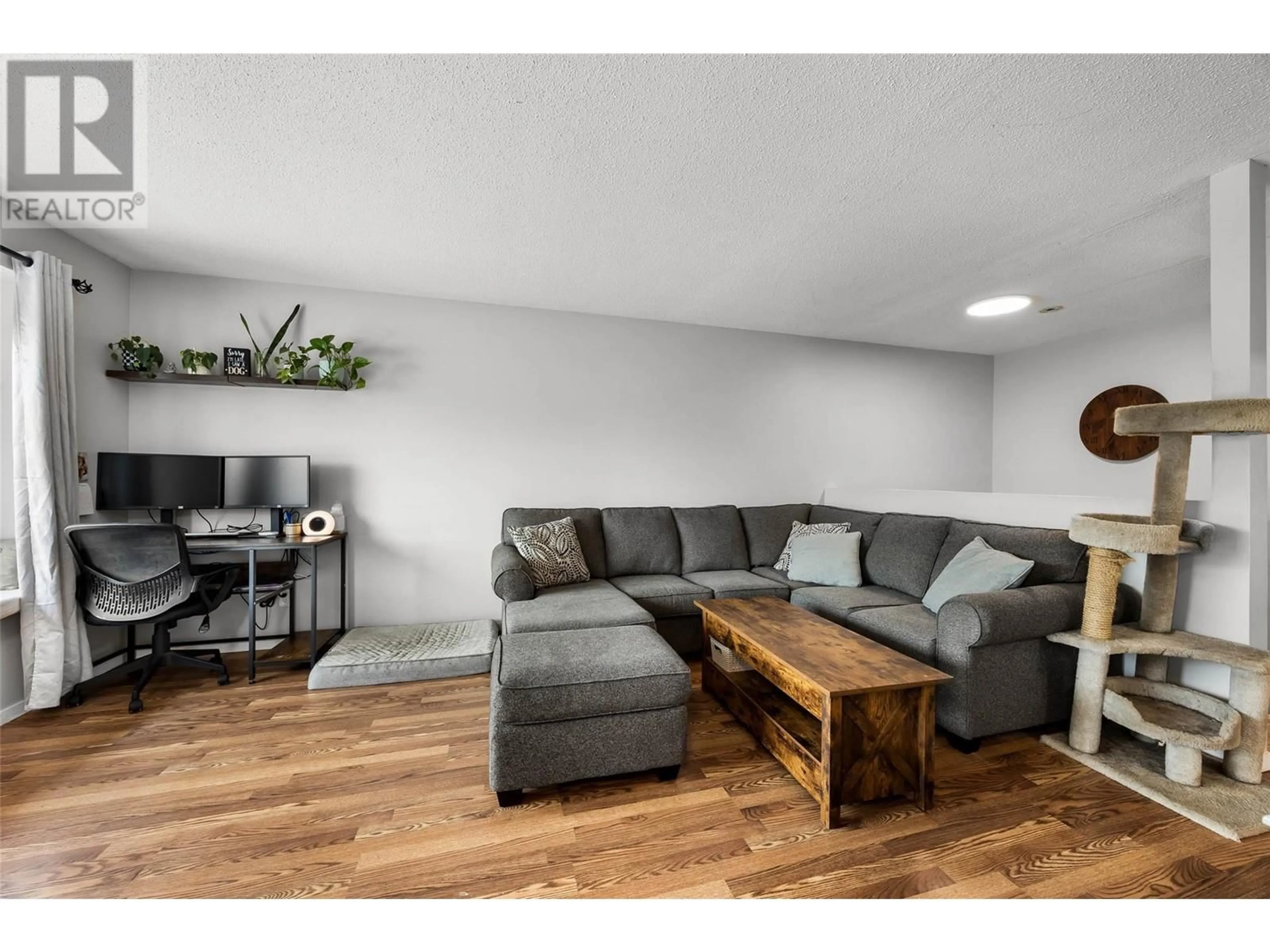 Living room with furniture, wood/laminate floor for 1634 Spartan Place, Kamloops British Columbia V2B7Z3