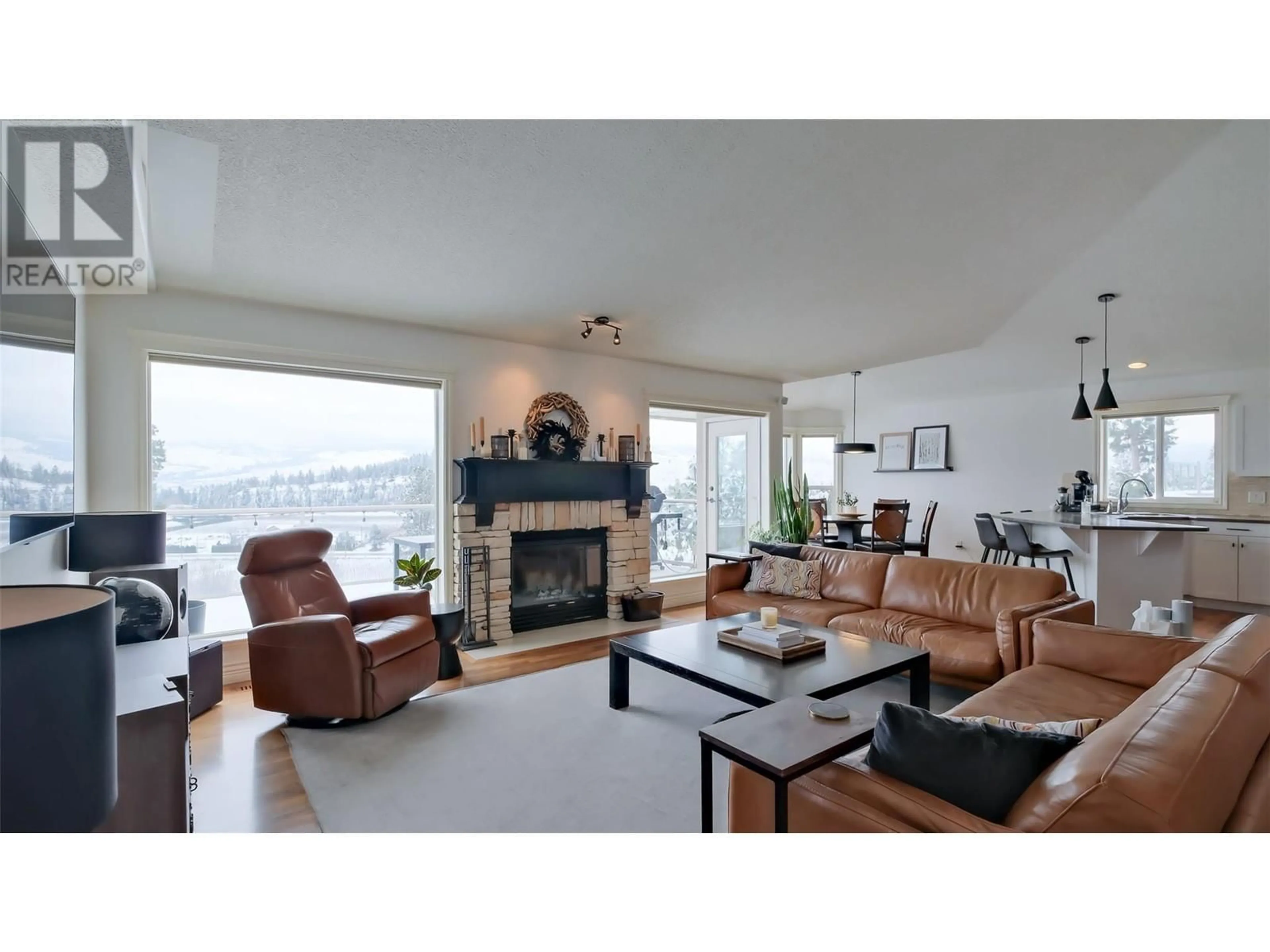 Living room with furniture, wood/laminate floor for 2377 Silver Place, Kelowna British Columbia V1V1M9