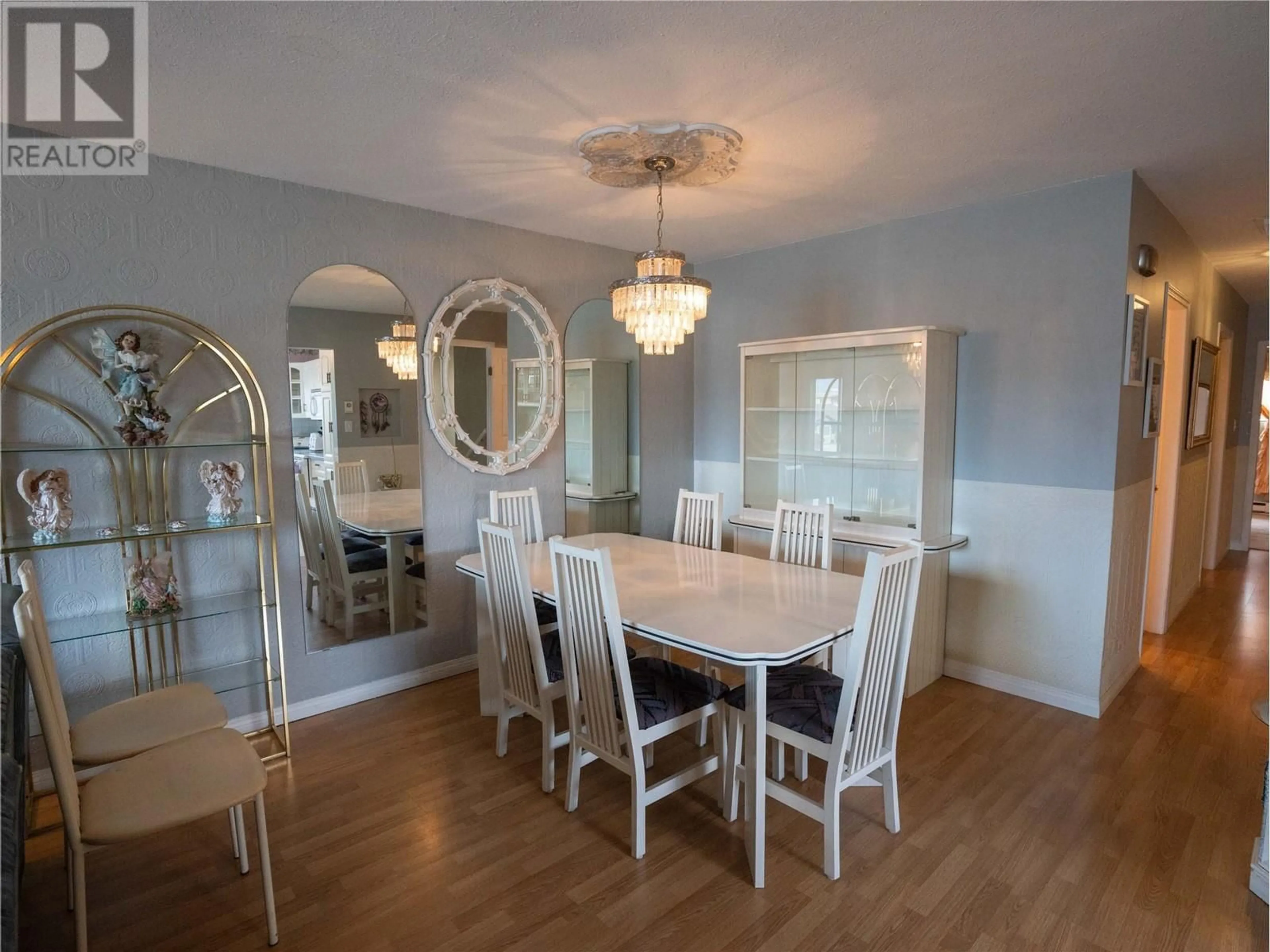 Dining room, wood/laminate floor for 196 Waterford Avenue, Penticton British Columbia V2A3T7