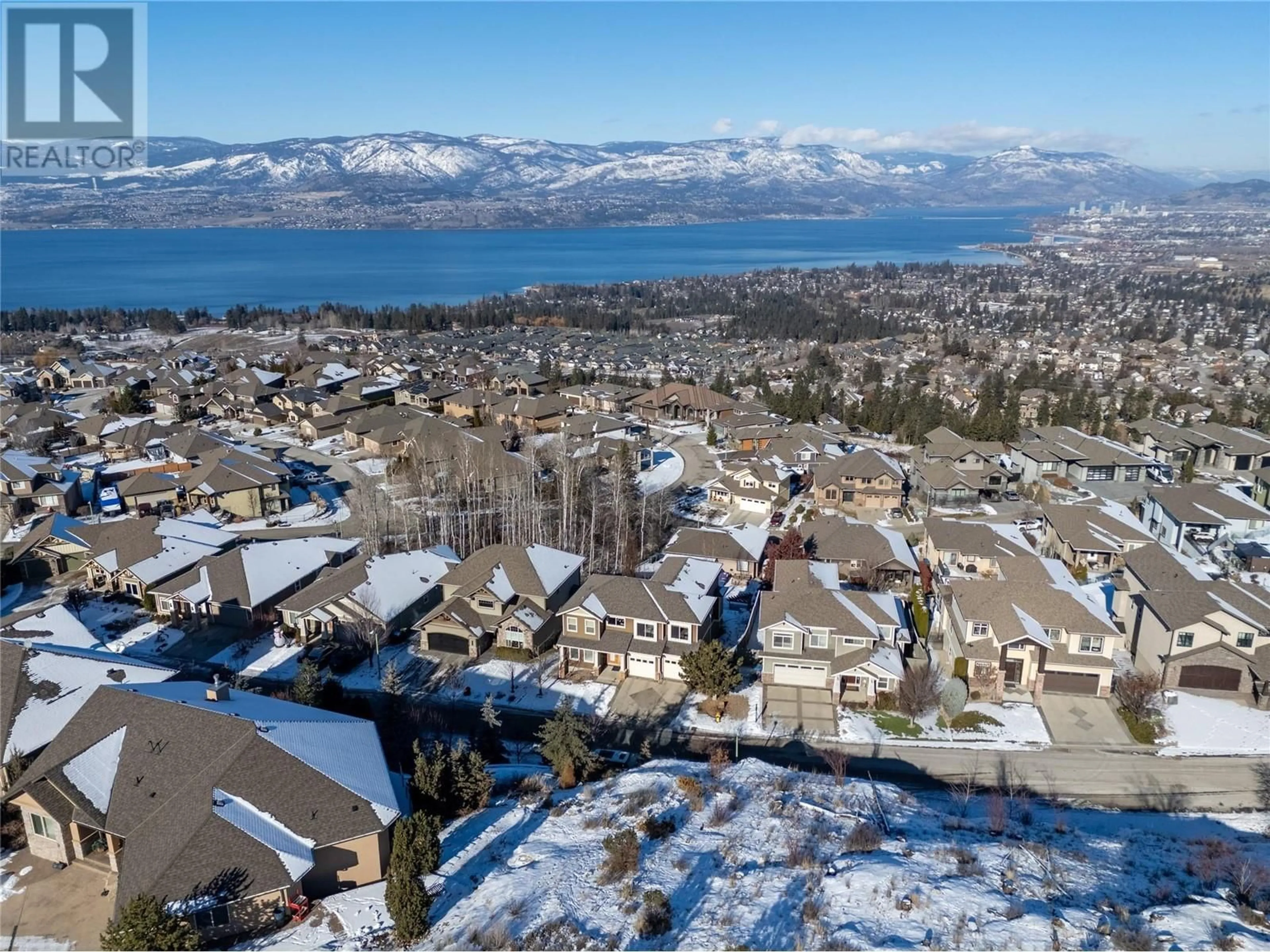 A pic from outside/outdoor area/front of a property/back of a property/a pic from drone, mountain view for 840 Hewetson Avenue, Kelowna British Columbia V1W5C9