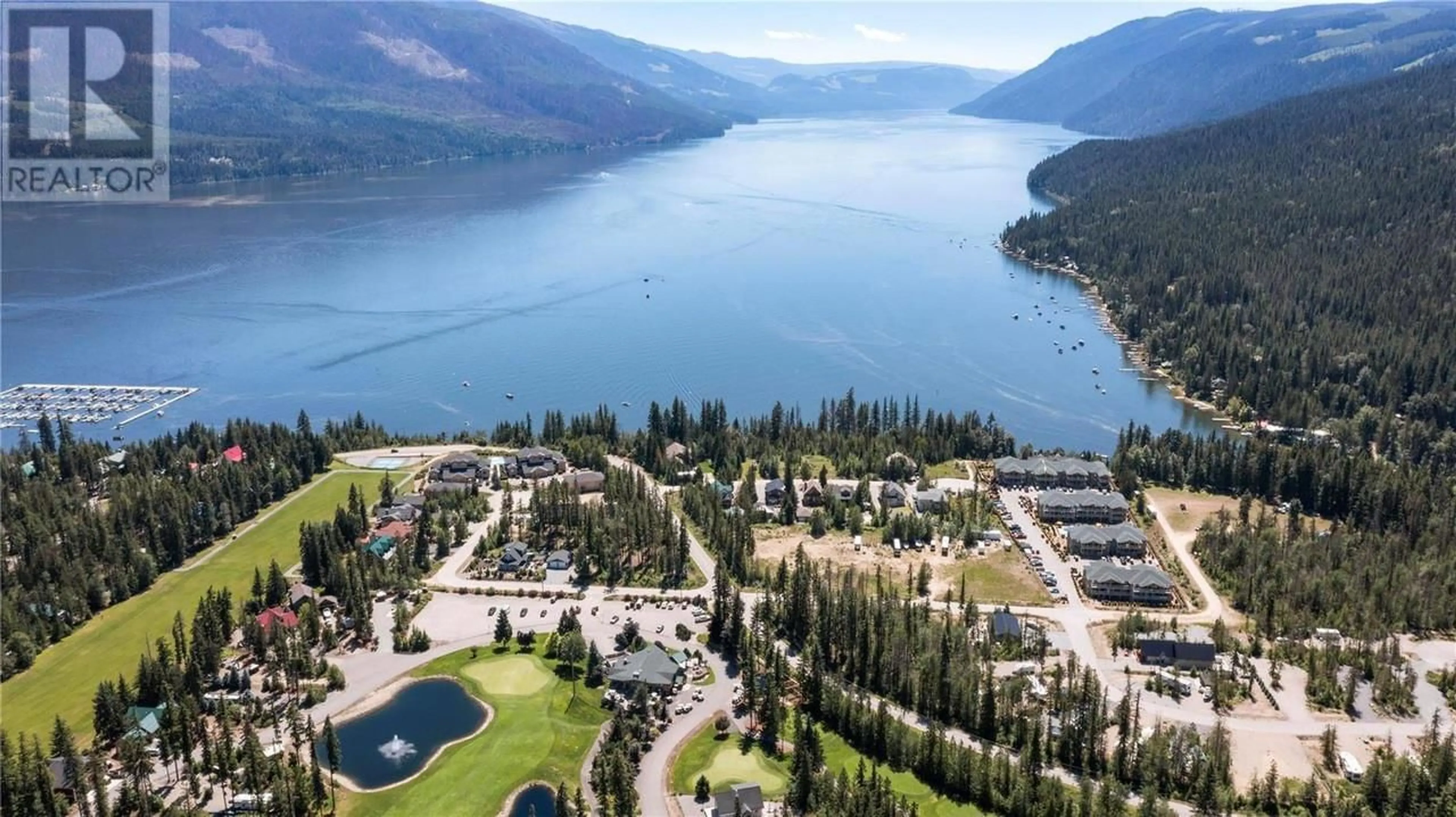 A pic from outside/outdoor area/front of a property/back of a property/a pic from drone, water/lake/river/ocean view for 3460 Parkway Road Unit# B103, Mabel Lake British Columbia V0E1V5