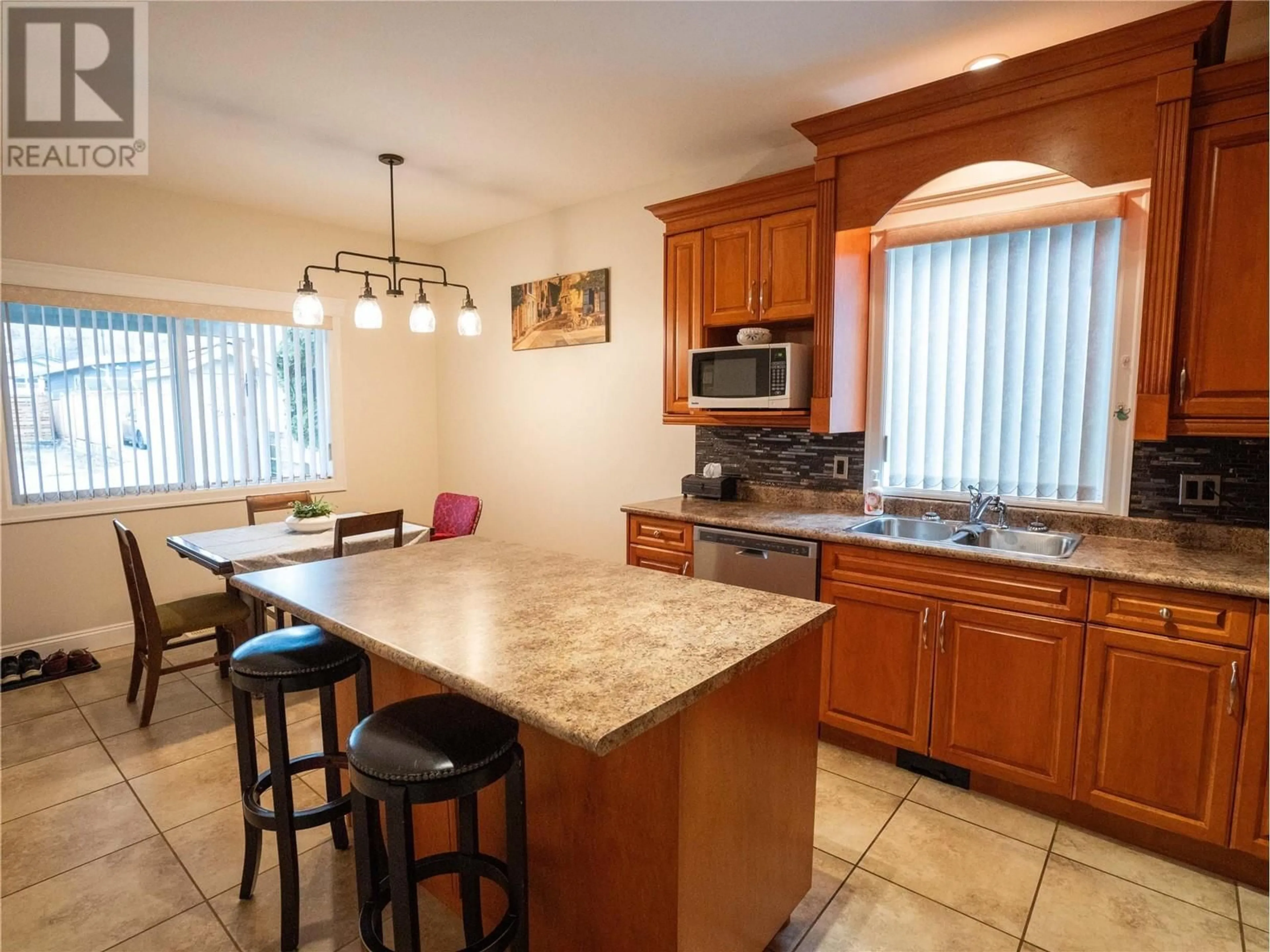 Open concept kitchen, ceramic/tile floor for 586 Papineau Street Unit# 102, Penticton British Columbia V2A4X5