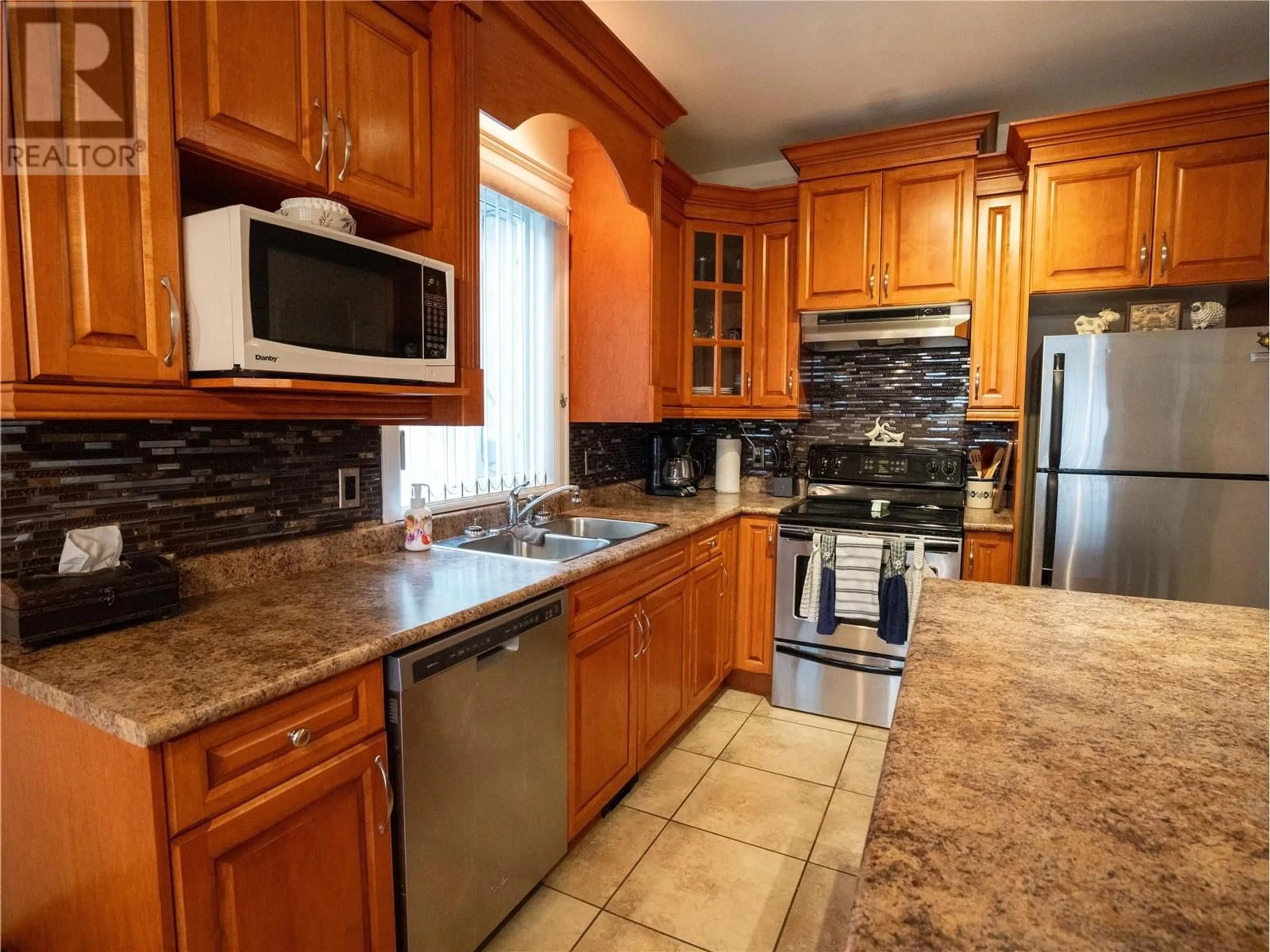 Standard kitchen, ceramic/tile floor for 586 Papineau Street Unit# 102, Penticton British Columbia V2A4X5