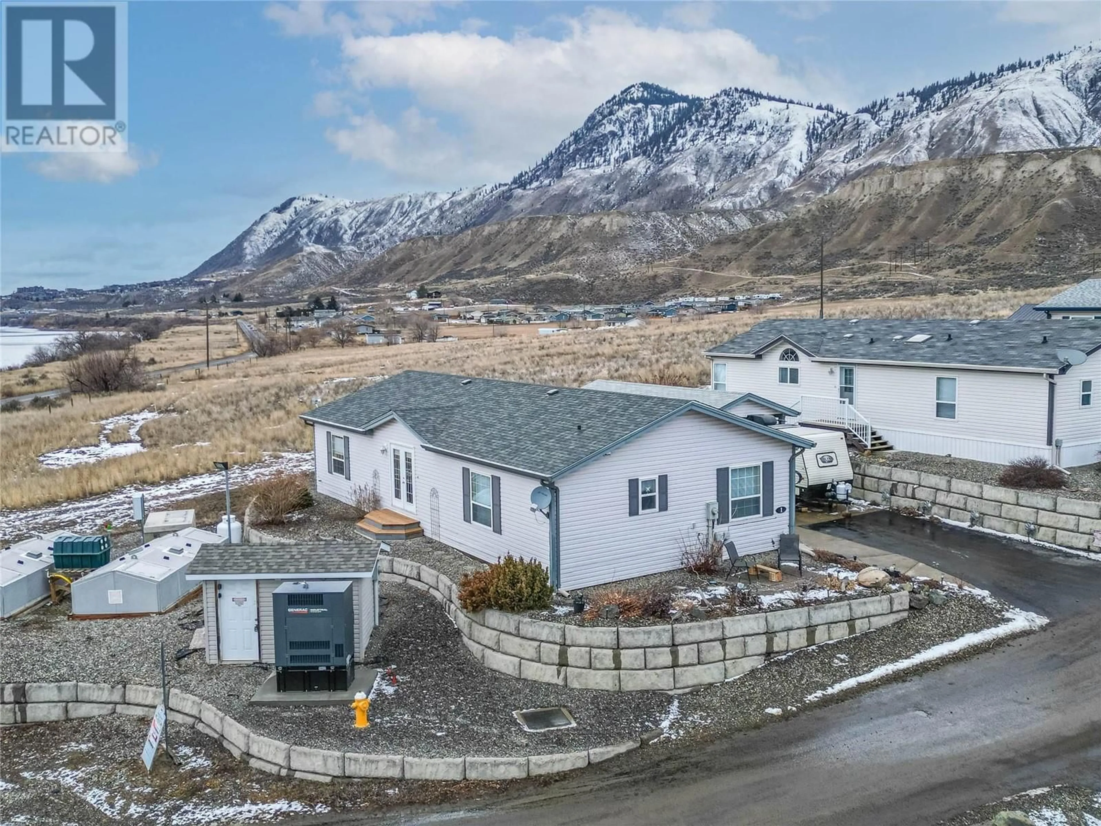 A pic from outside/outdoor area/front of a property/back of a property/a pic from drone, mountain view for 768 SHUSWAP Road E Unit# 1, Kamloops British Columbia V2H0A4