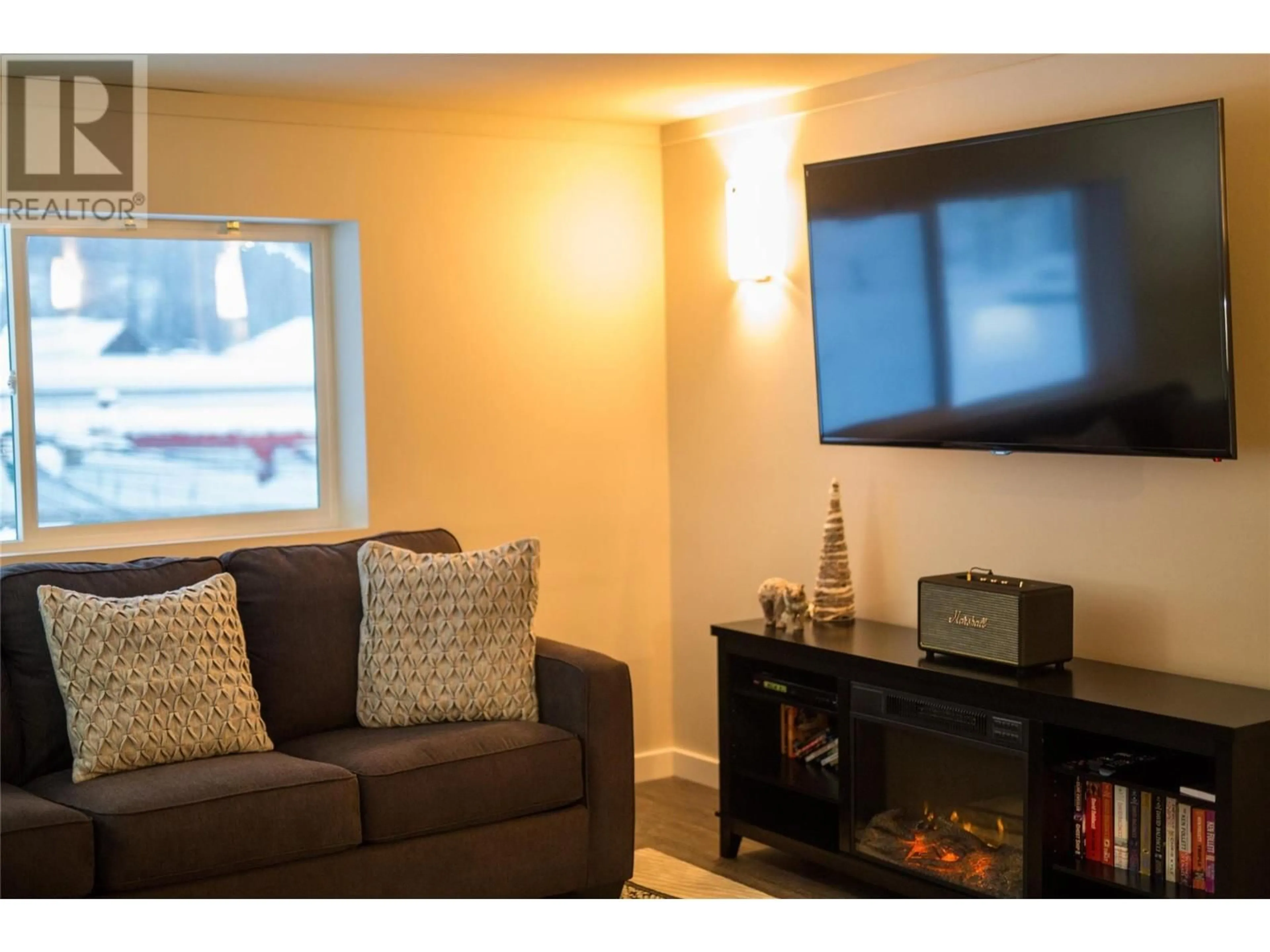 Living room with furniture, wood/laminate floor for 103B 1240 Powerhouse Road, Revelstoke British Columbia V0E2S0