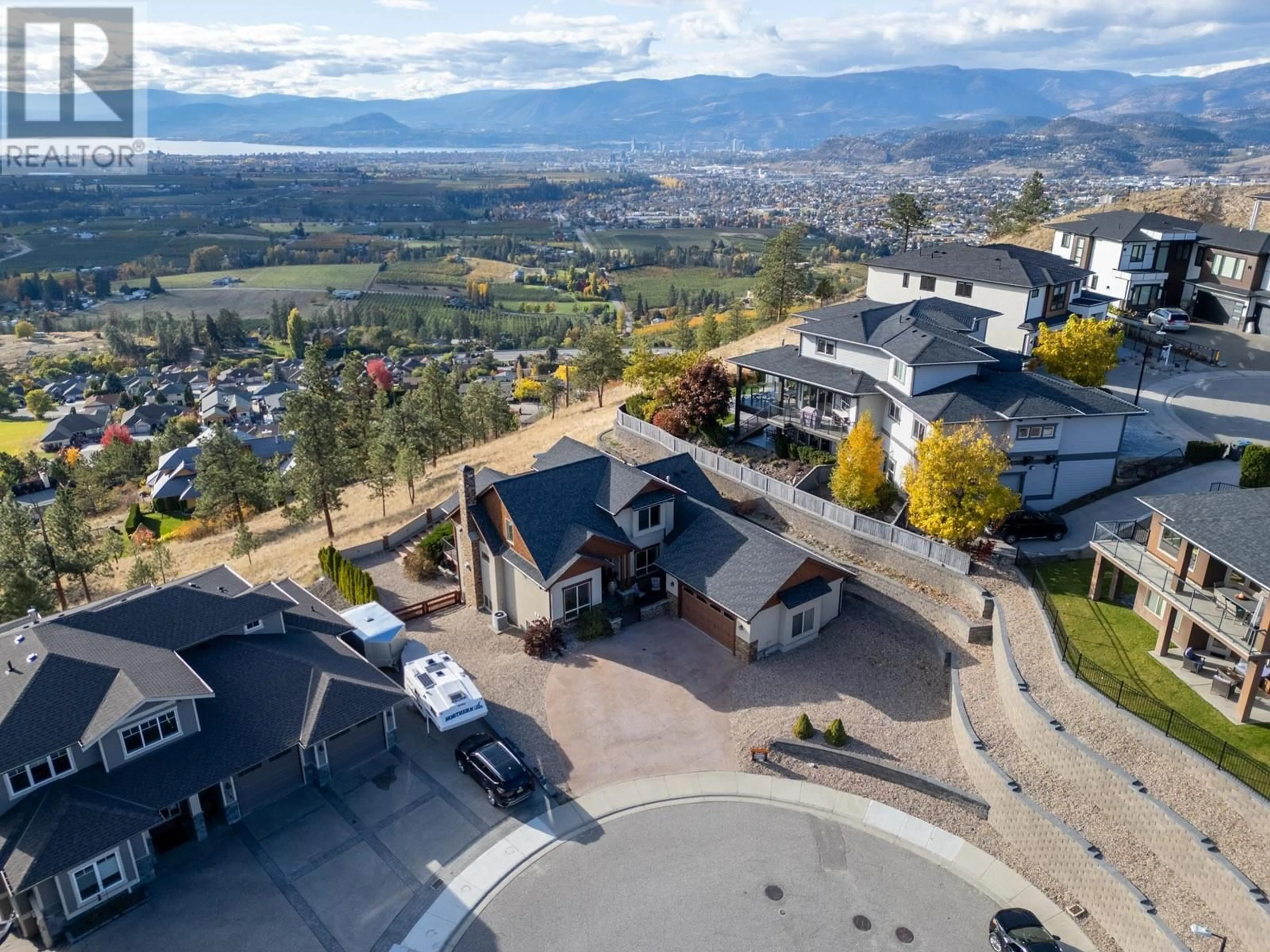 A pic from outside/outdoor area/front of a property/back of a property/a pic from drone, mountain view for 1294 Samurai Court, Kelowna British Columbia V1P1S2