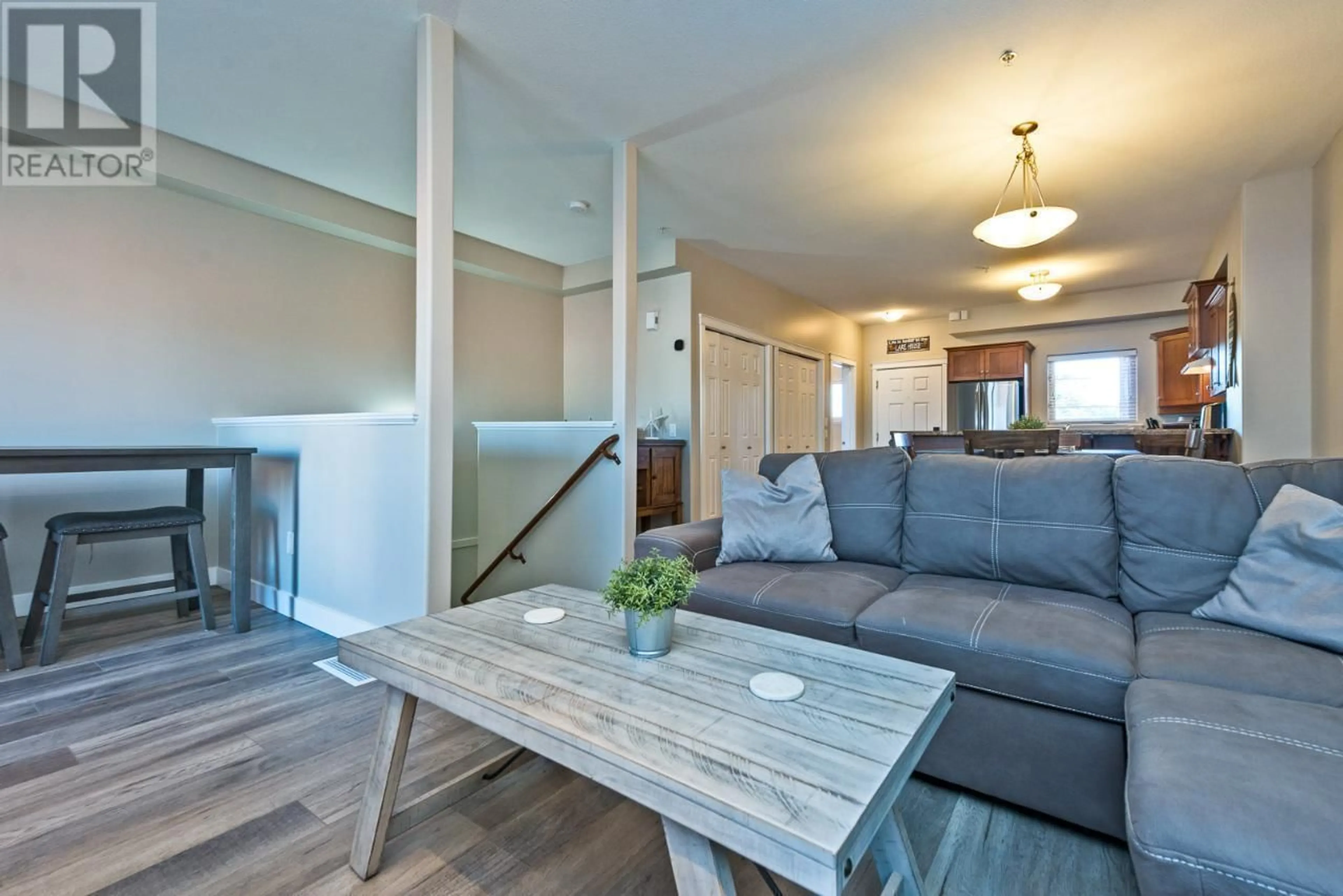 Living room with furniture, wood/laminate floor for 103 - 4300 44TH AVENUE, Osoyoos British Columbia V0H1V6