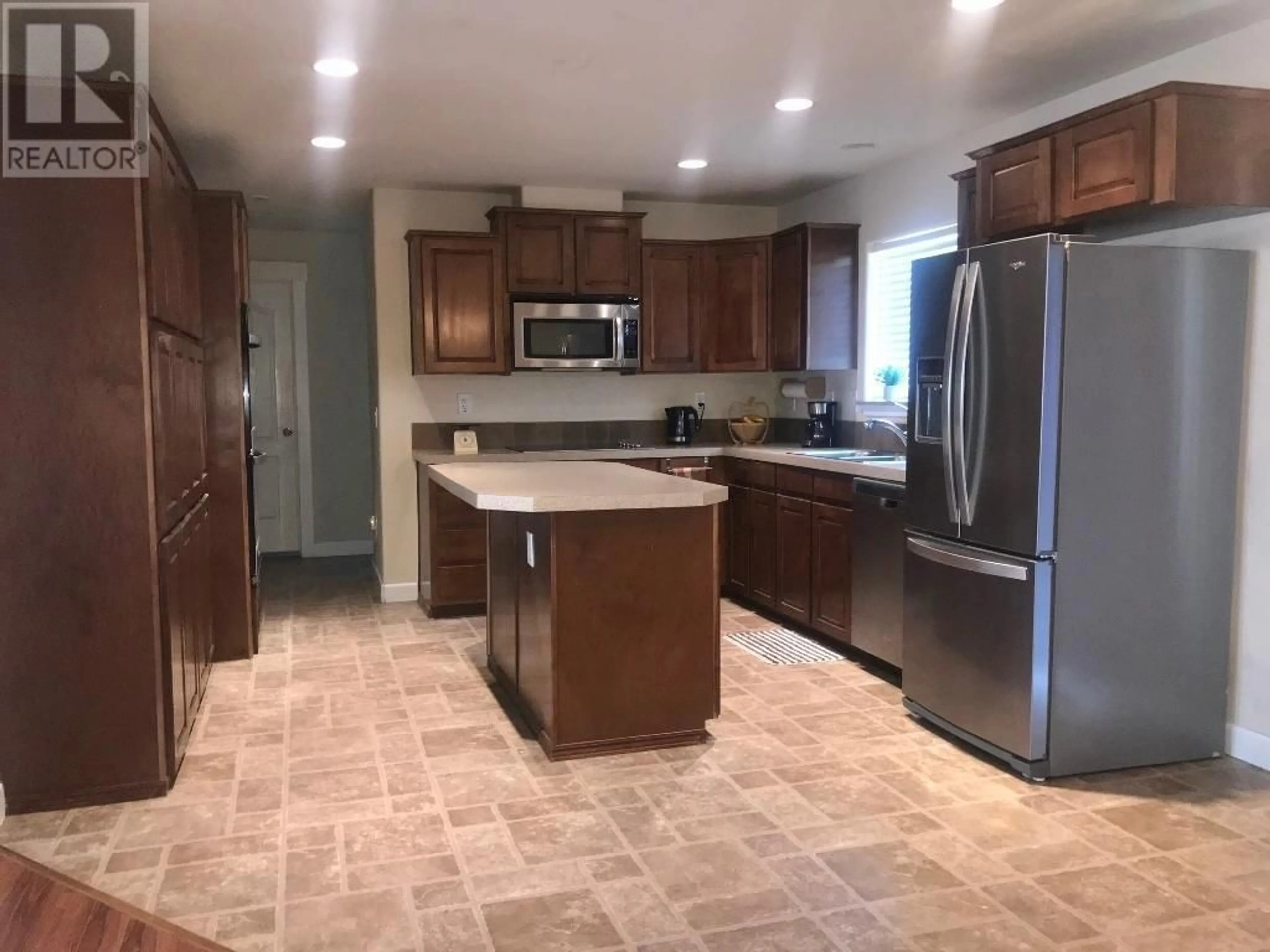 Open concept kitchen, ceramic/tile floor for 7357 10TH Street, Grand Forks British Columbia V0H1H0