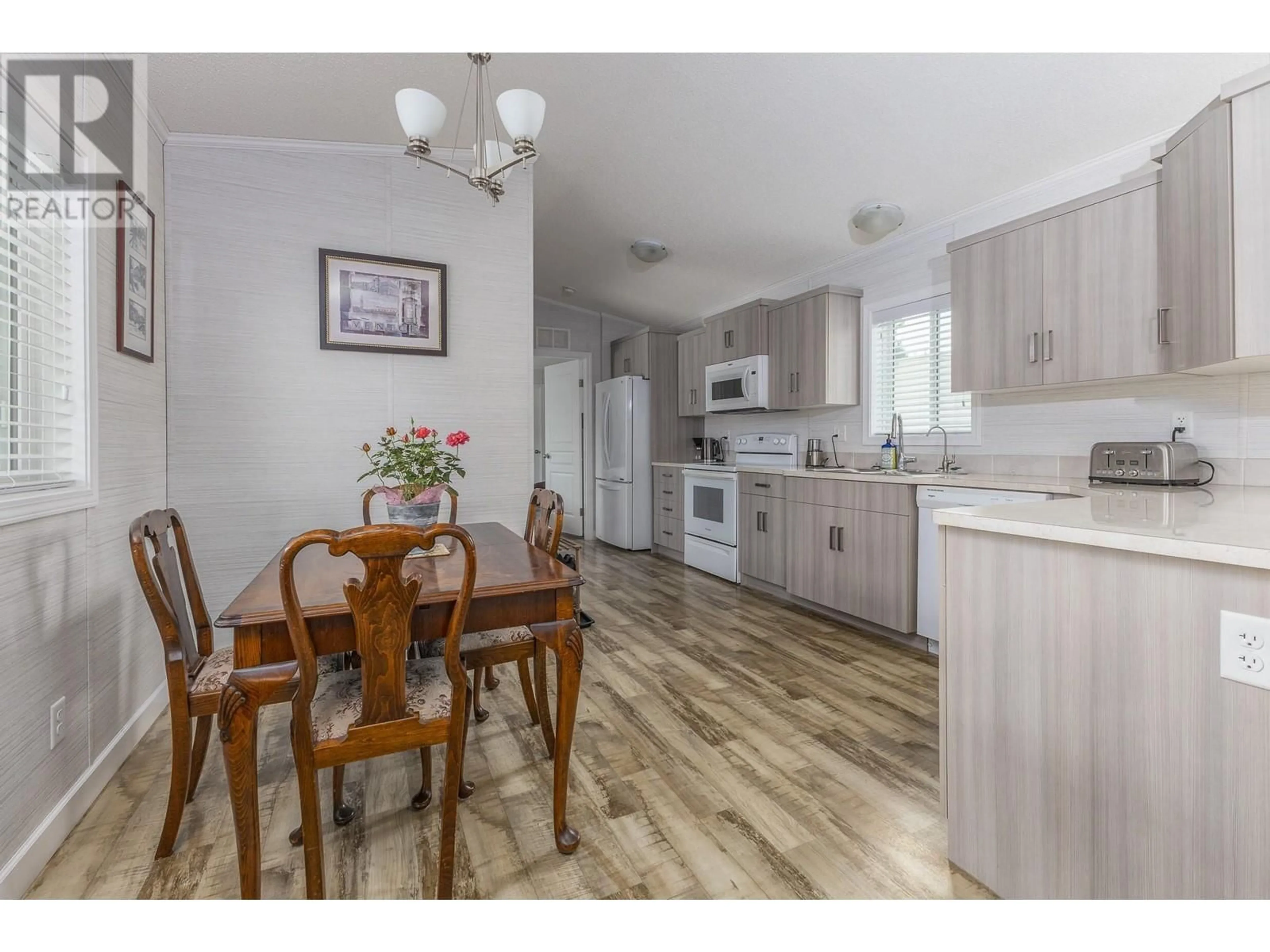Open concept kitchen, wood/laminate floor for 73 - 3350 10 AVENUE NORTHEAST, Salmon Arm British Columbia V1E1J6