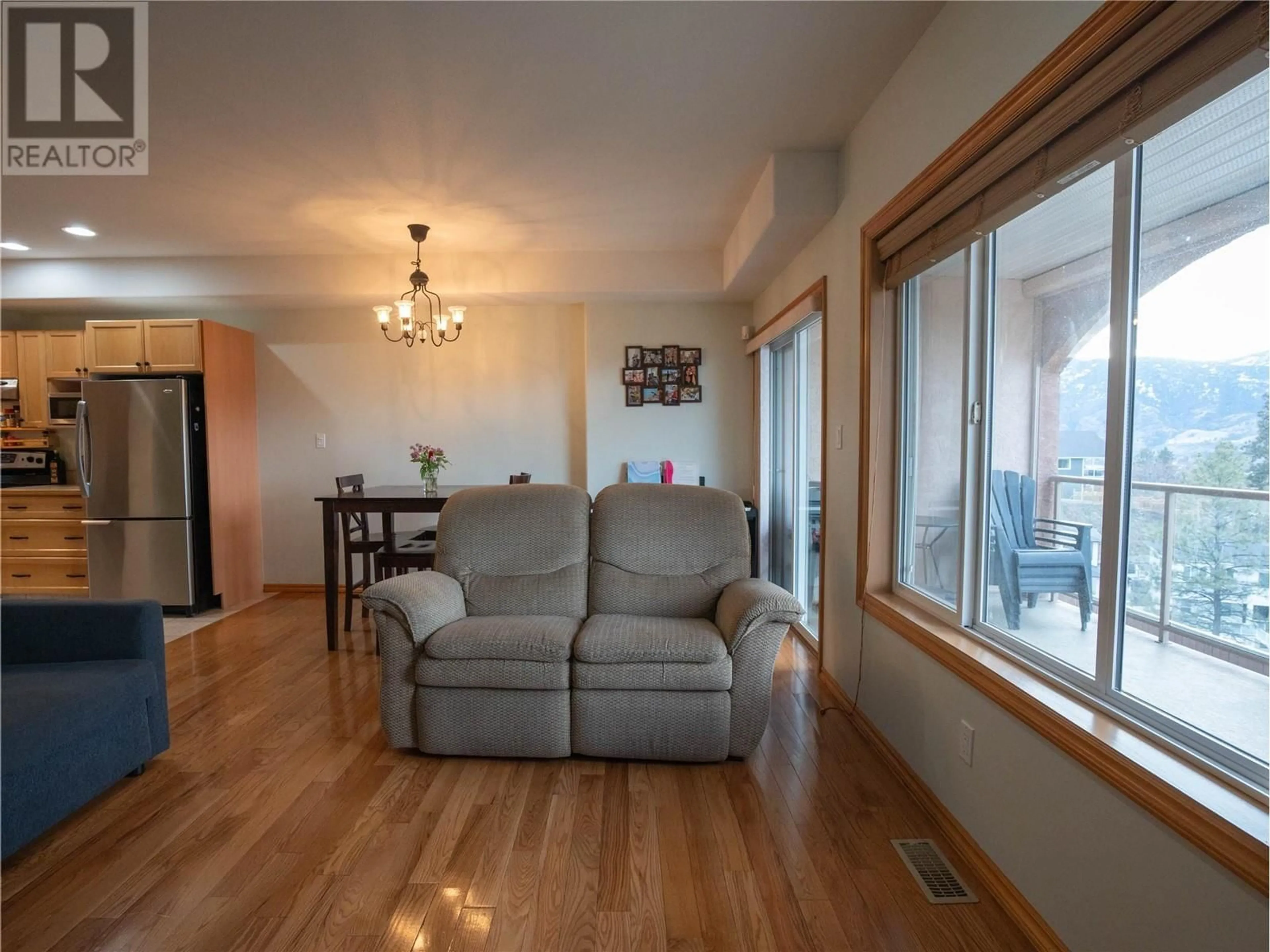 Living room with furniture, wood/laminate floor for 705 Balsam Avenue Unit# 116, Penticton British Columbia V2A9B7