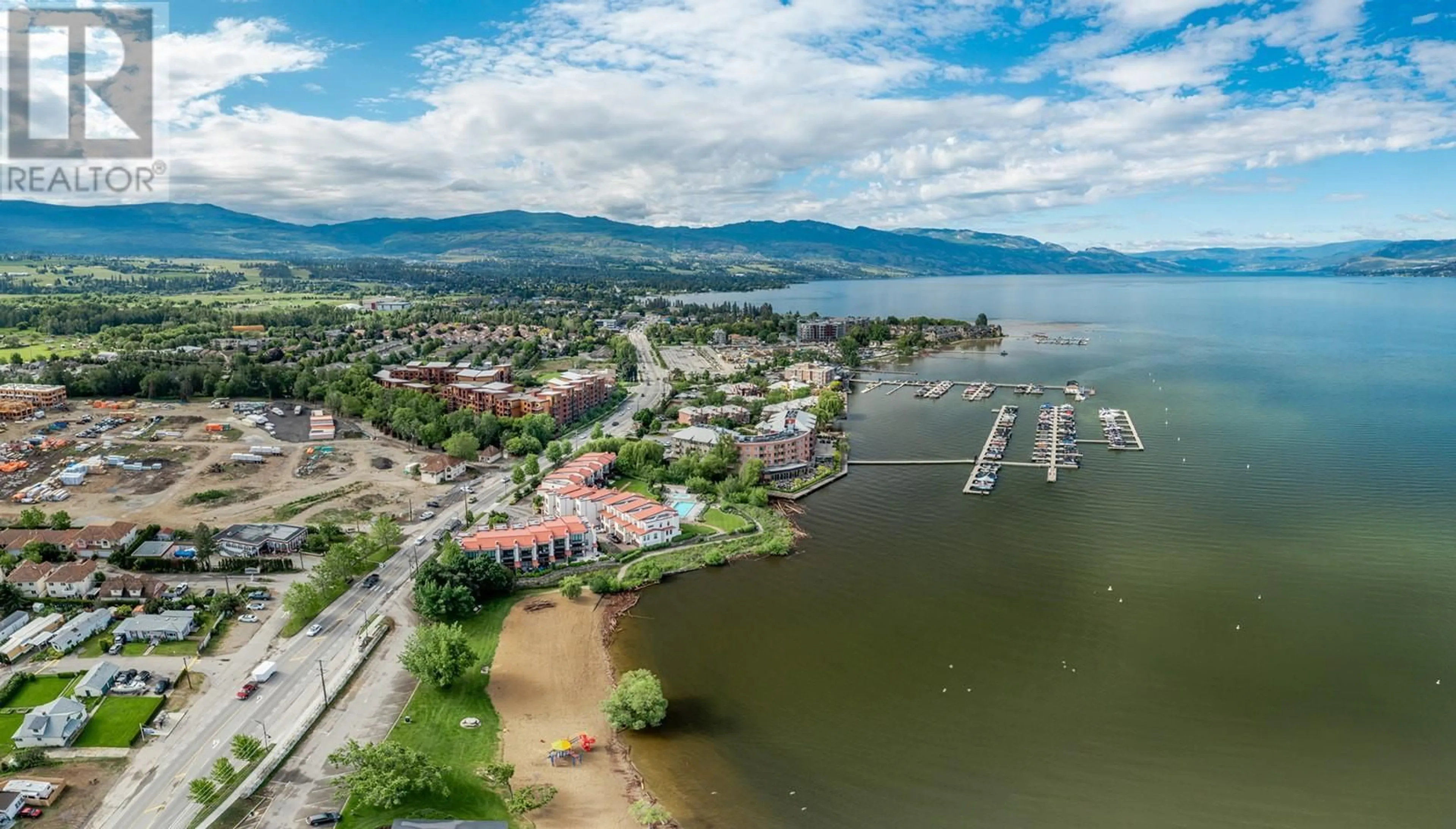 A pic from outside/outdoor area/front of a property/back of a property/a pic from drone, water/lake/river/ocean view for 321 - 654 COOK ROAD, Kelowna British Columbia V1W3G7
