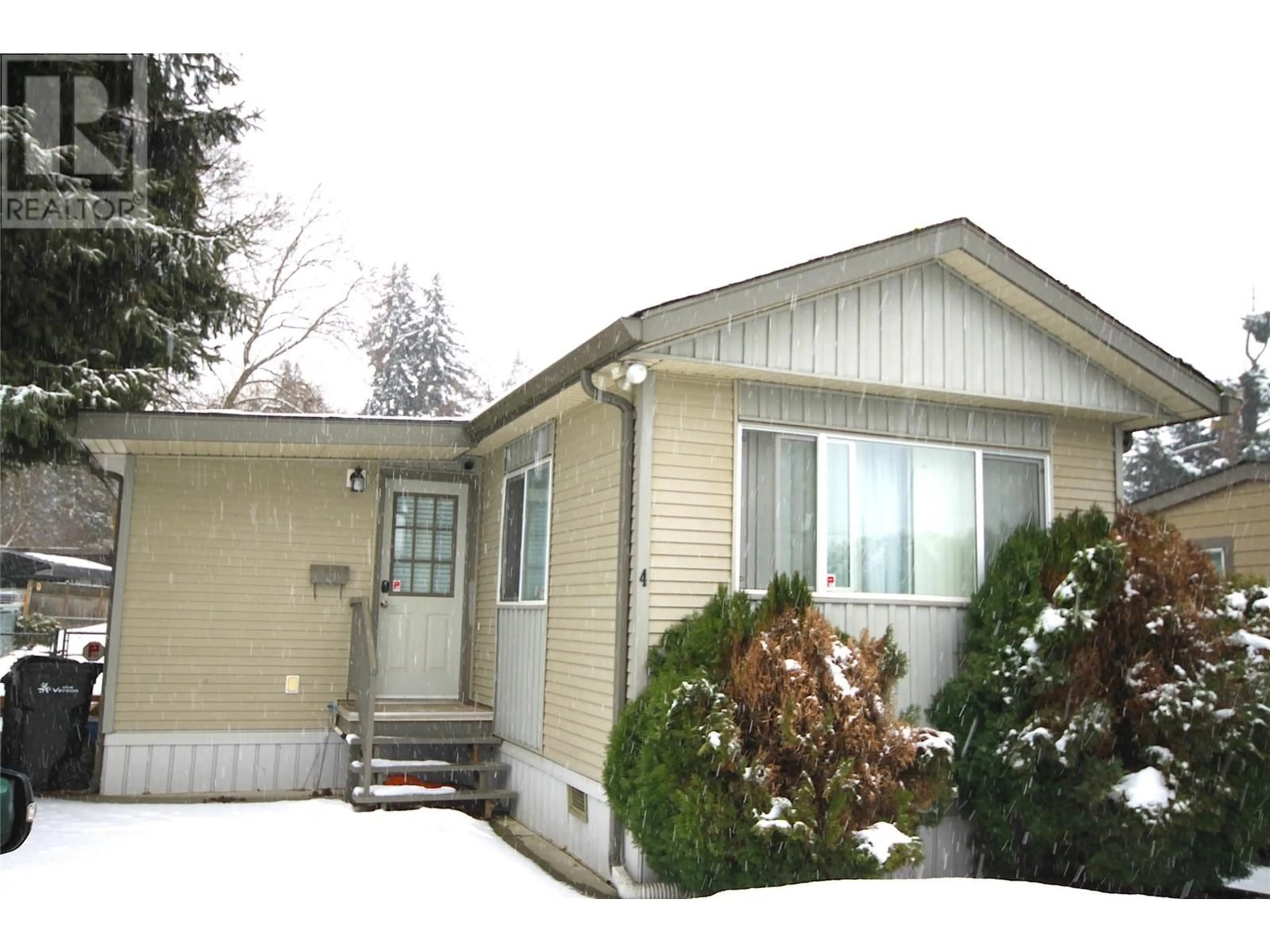 Home with vinyl exterior material, street for 4701 Pleasant Valley Road Unit# 4, Vernon British Columbia V1T4M7