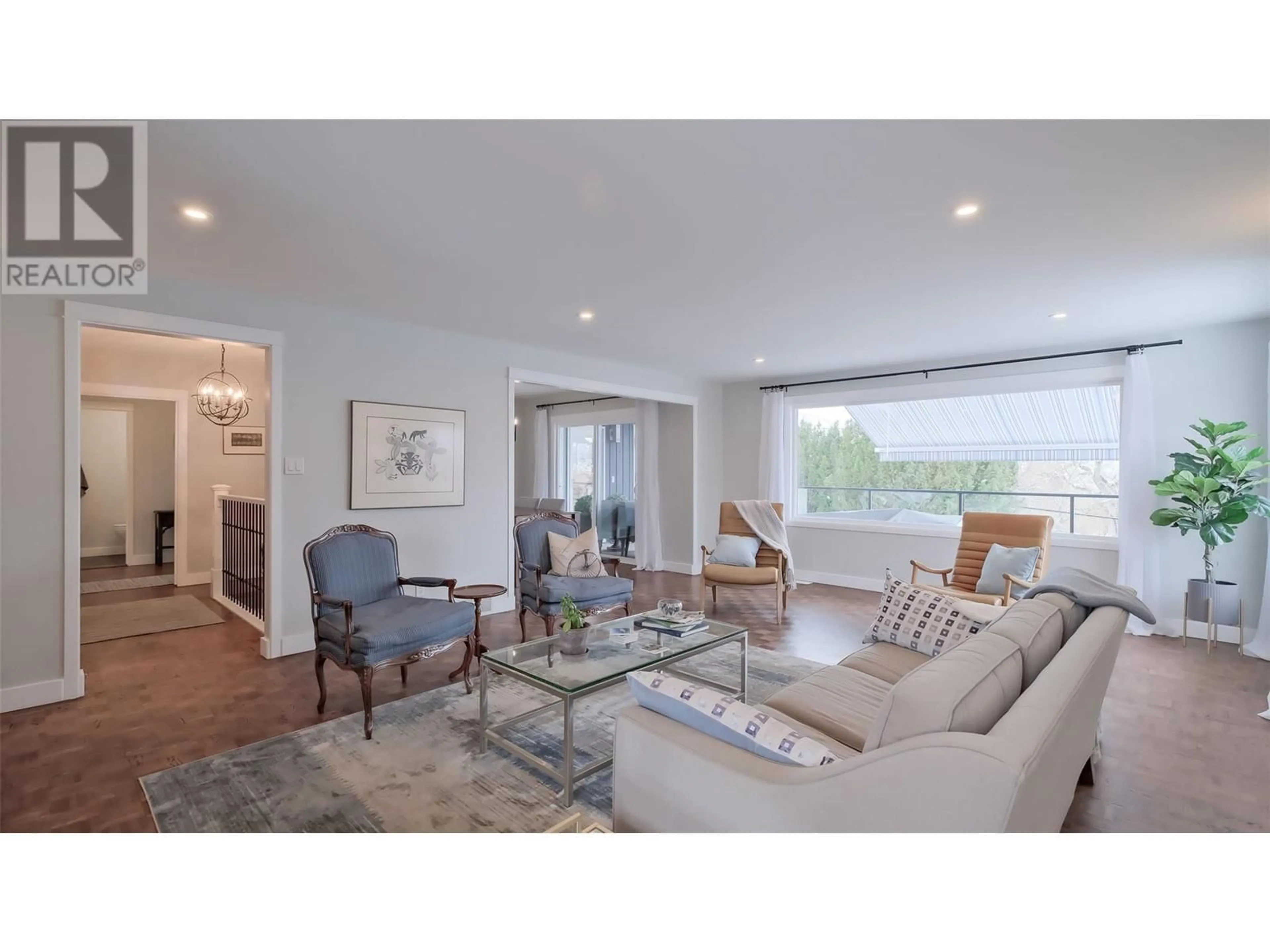 Living room with furniture, wood/laminate floor for 102 BARRINGTON Place, Penticton British Columbia V2A1S4