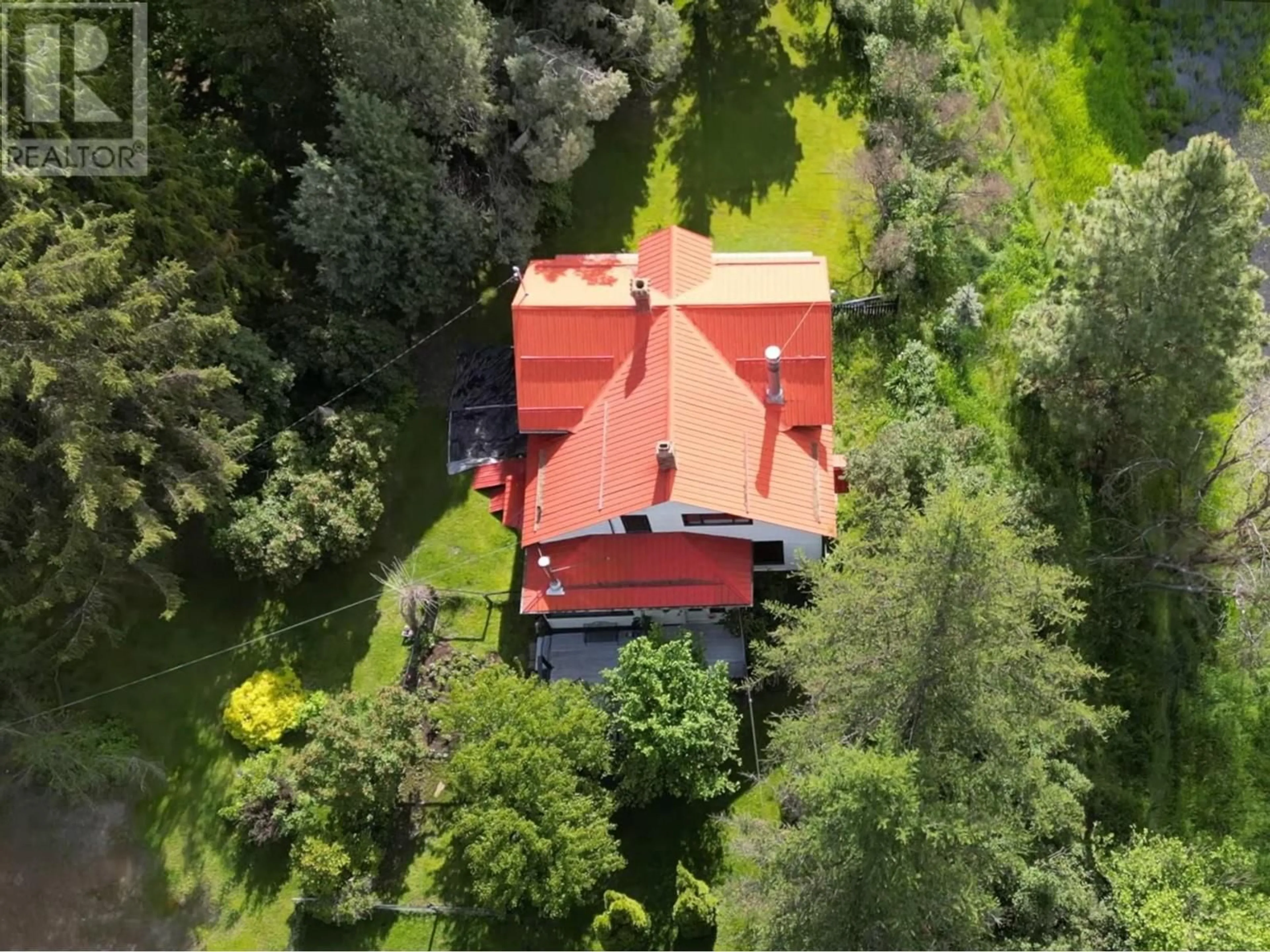 A pic from outside/outdoor area/front of a property/back of a property/a pic from drone, mountain view for 2675 65 AVENUE, Grand Forks British Columbia V0H1H0