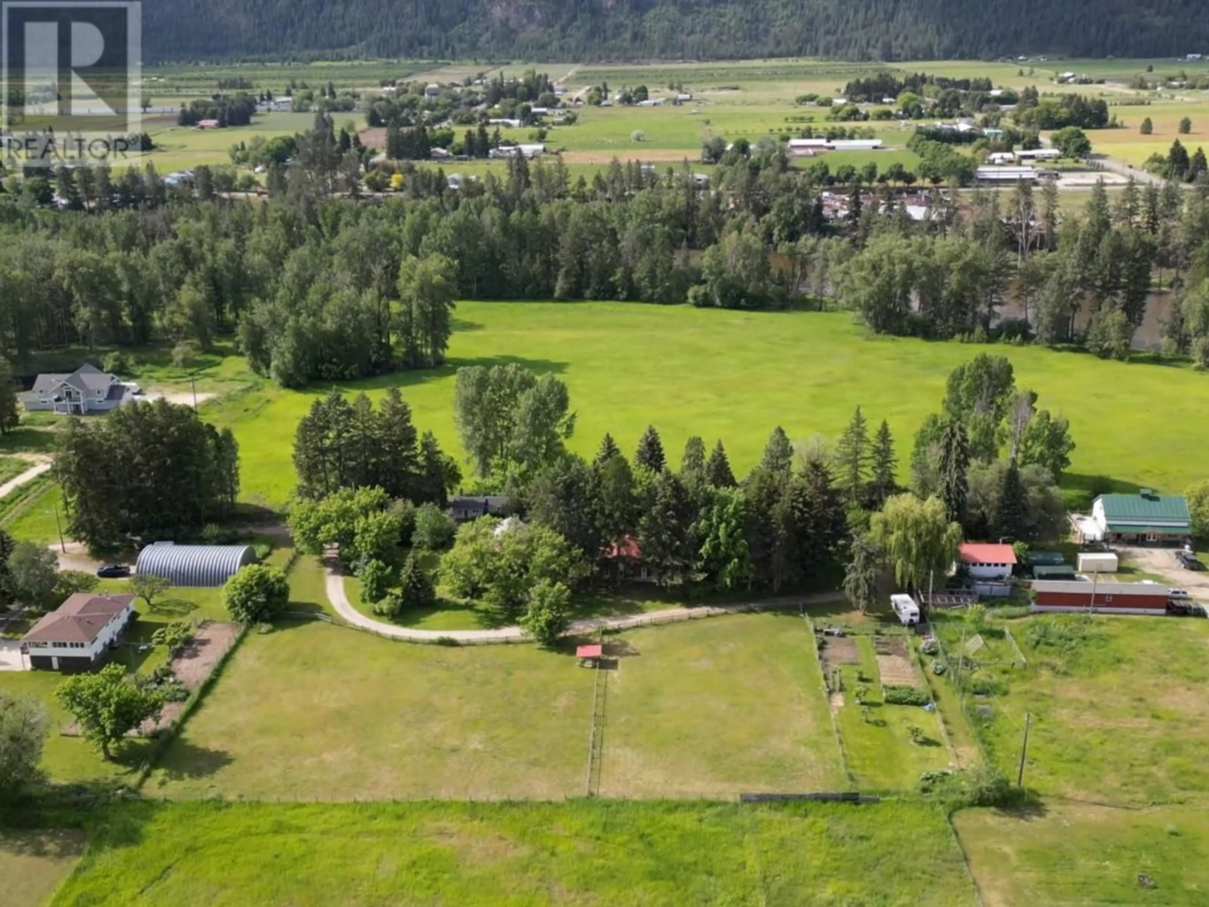 A pic from outside/outdoor area/front of a property/back of a property/a pic from drone, forest/trees view for 2675 65 AVENUE, Grand Forks British Columbia V0H1H0