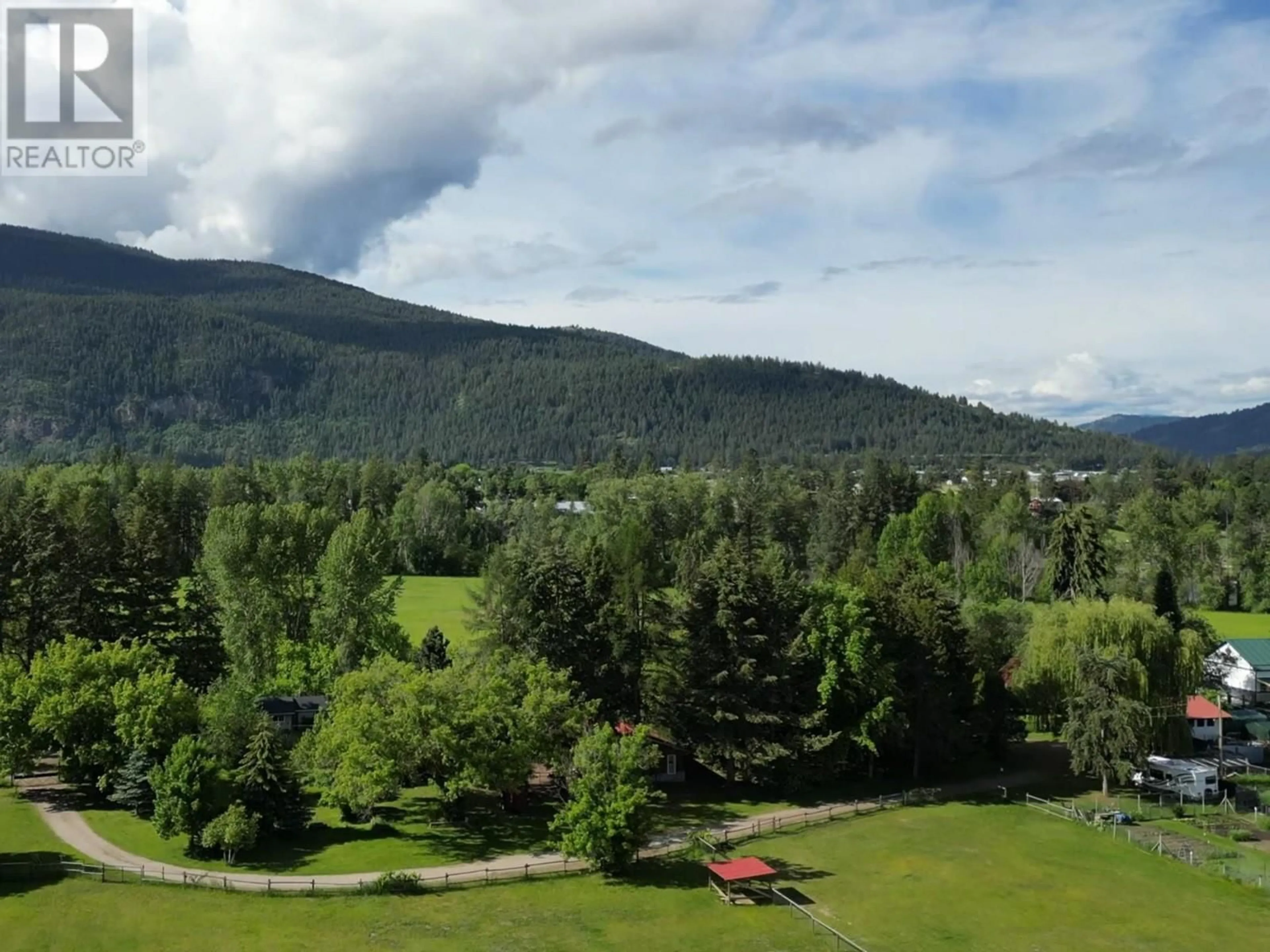 A pic from outside/outdoor area/front of a property/back of a property/a pic from drone, mountain view for 2675 65 AVENUE, Grand Forks British Columbia V0H1H0