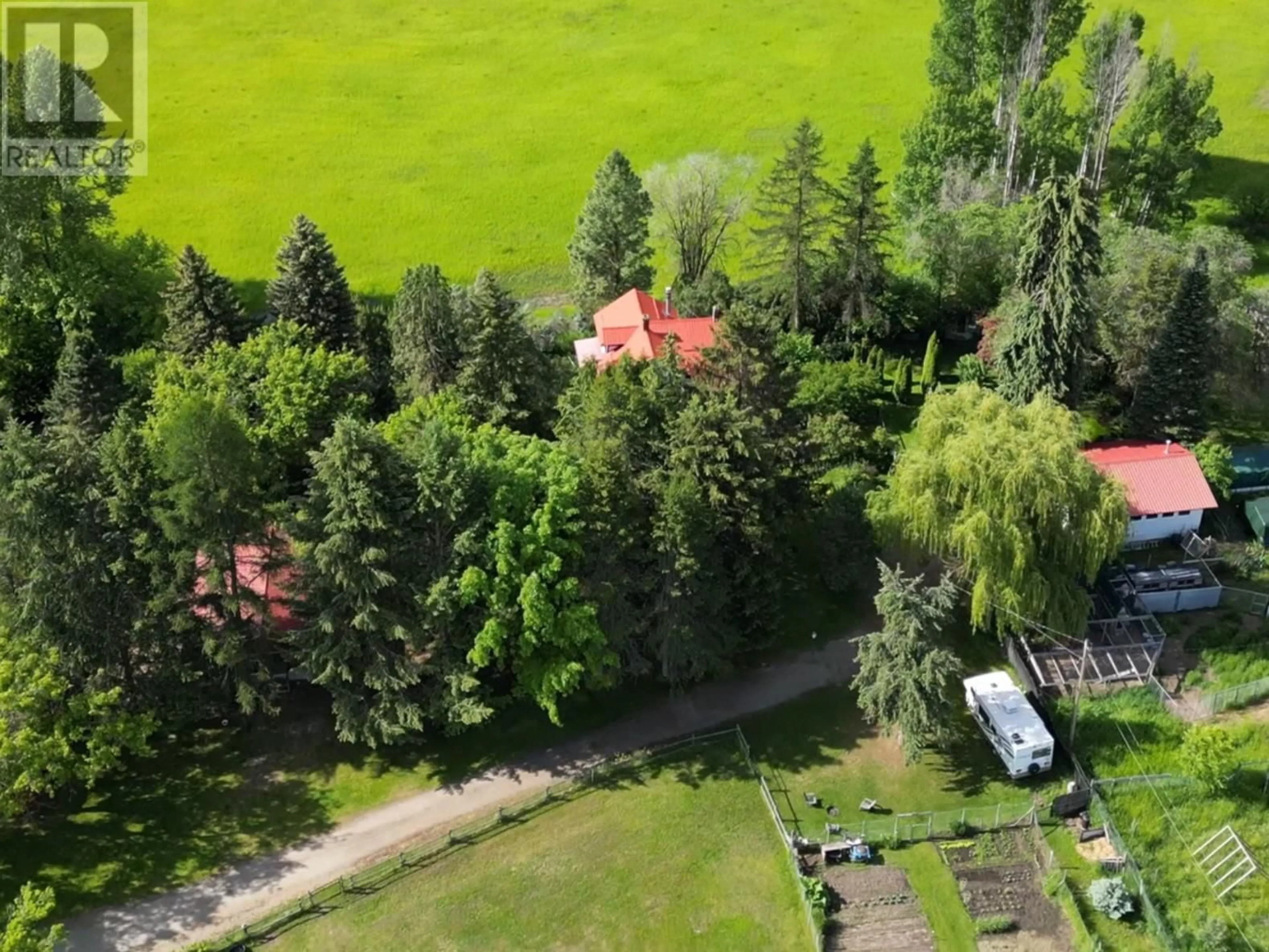 A pic from outside/outdoor area/front of a property/back of a property/a pic from drone, forest/trees view for 2675 65 Avenue, Grand Forks British Columbia V0H1H0