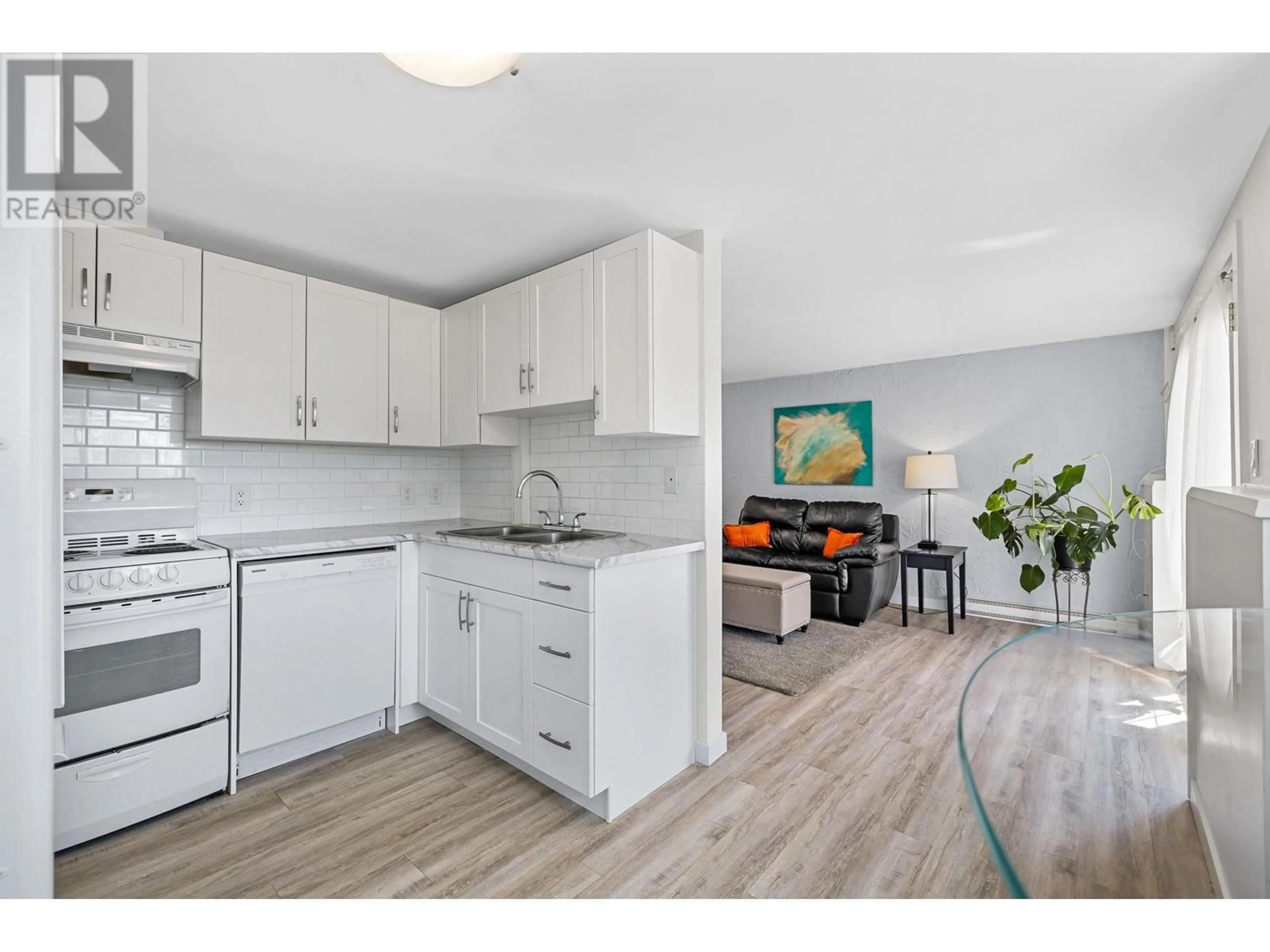 Open concept kitchen, wood/laminate floor for 445 Holbrook Road W Unit# 9, Kelowna British Columbia V1X1S4