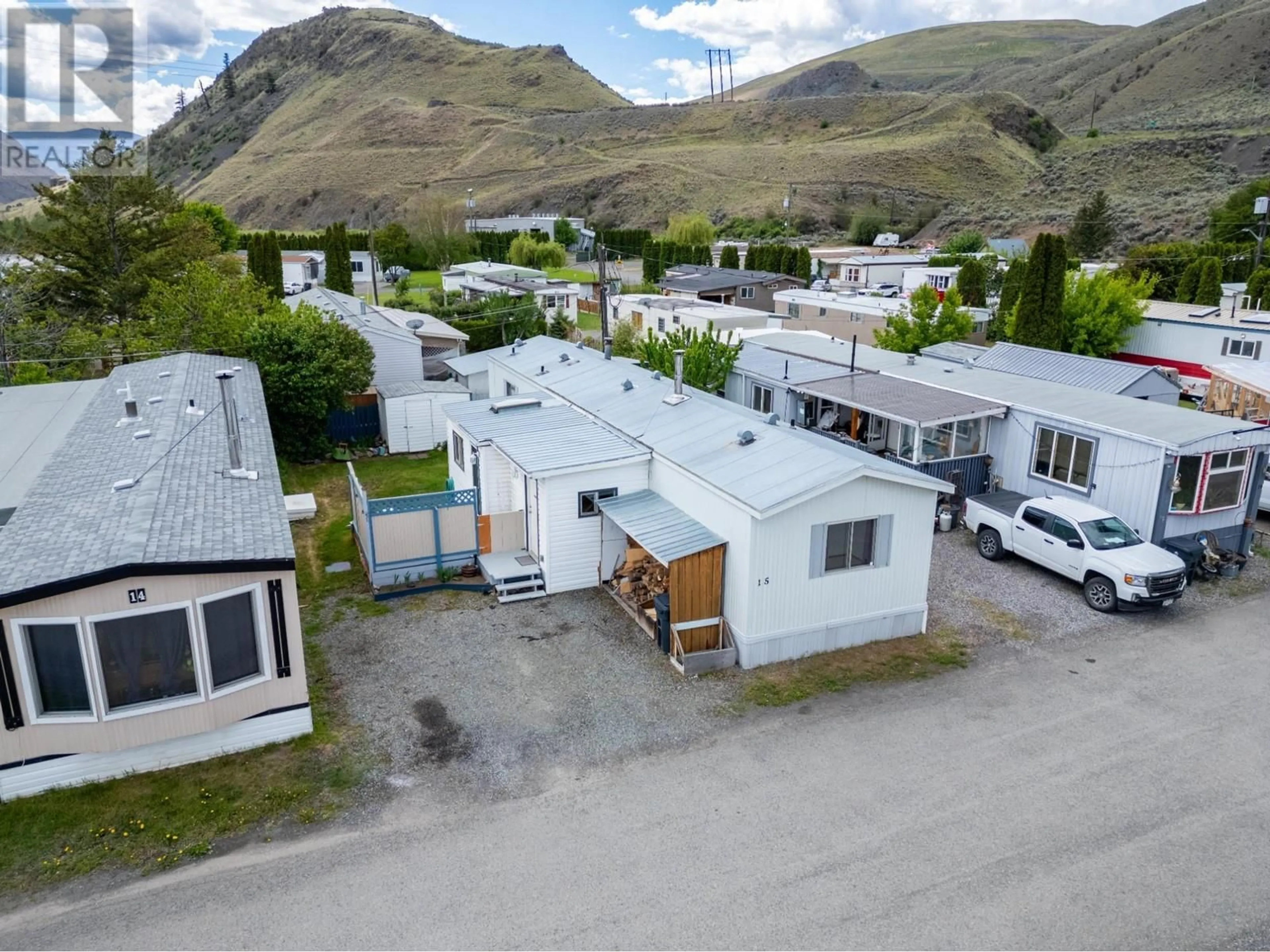 A pic from outside/outdoor area/front of a property/back of a property/a pic from drone, mountain view for 701 TRANS CANADA Highway Unit# 15, Cache Creek British Columbia V0K1H0