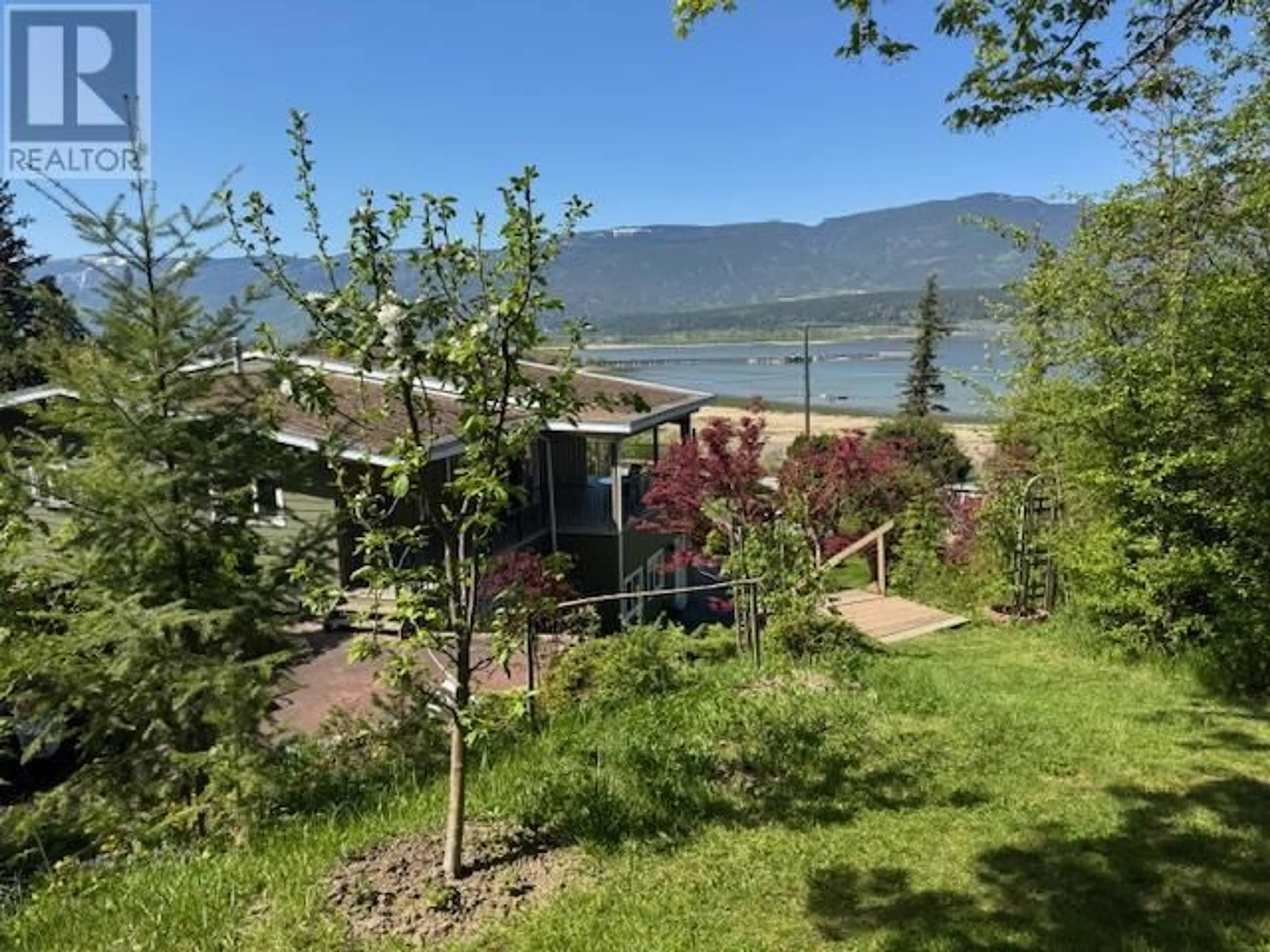 A pic from outside/outdoor area/front of a property/back of a property/a pic from drone, water/lake/river/ocean view for 1280 LAKESHORE ROAD NORTHEAST, Salmon Arm British Columbia V1E2V7