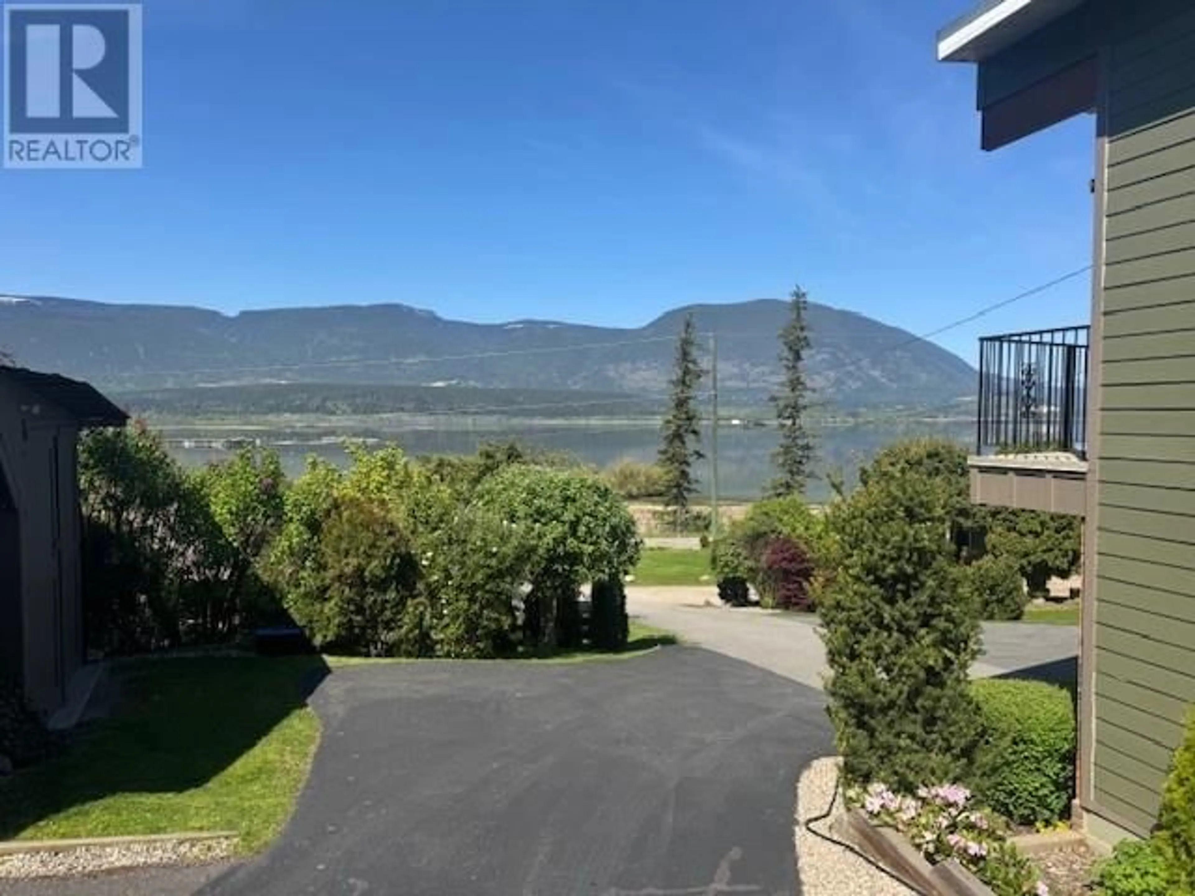 A pic from outside/outdoor area/front of a property/back of a property/a pic from drone, water/lake/river/ocean view for 1280 LAKESHORE ROAD NORTHEAST, Salmon Arm British Columbia V1E2V7