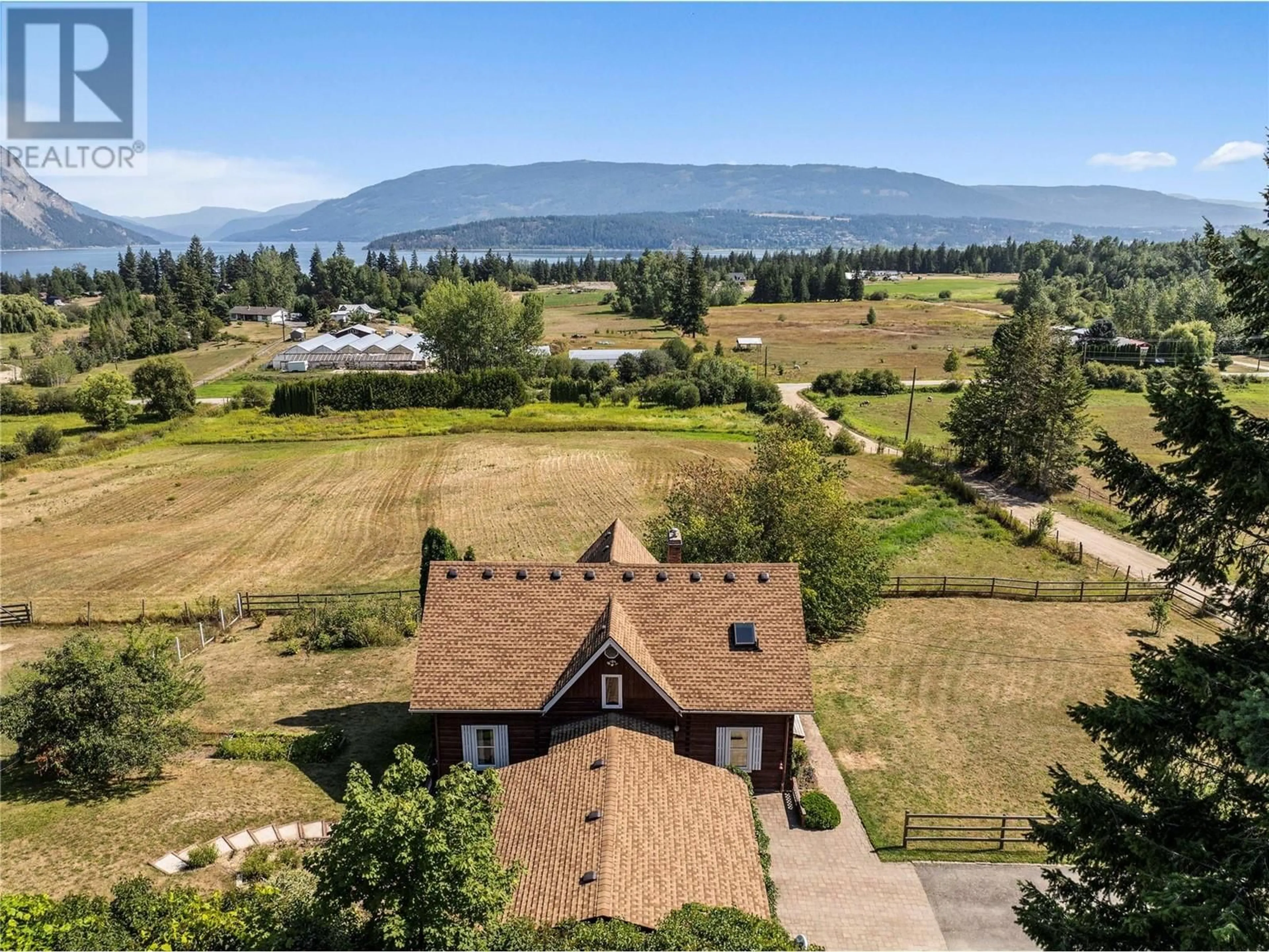 A pic from outside/outdoor area/front of a property/back of a property/a pic from drone, mountain view for 5931 40 Street NW, Salmon Arm British Columbia V1E3B6