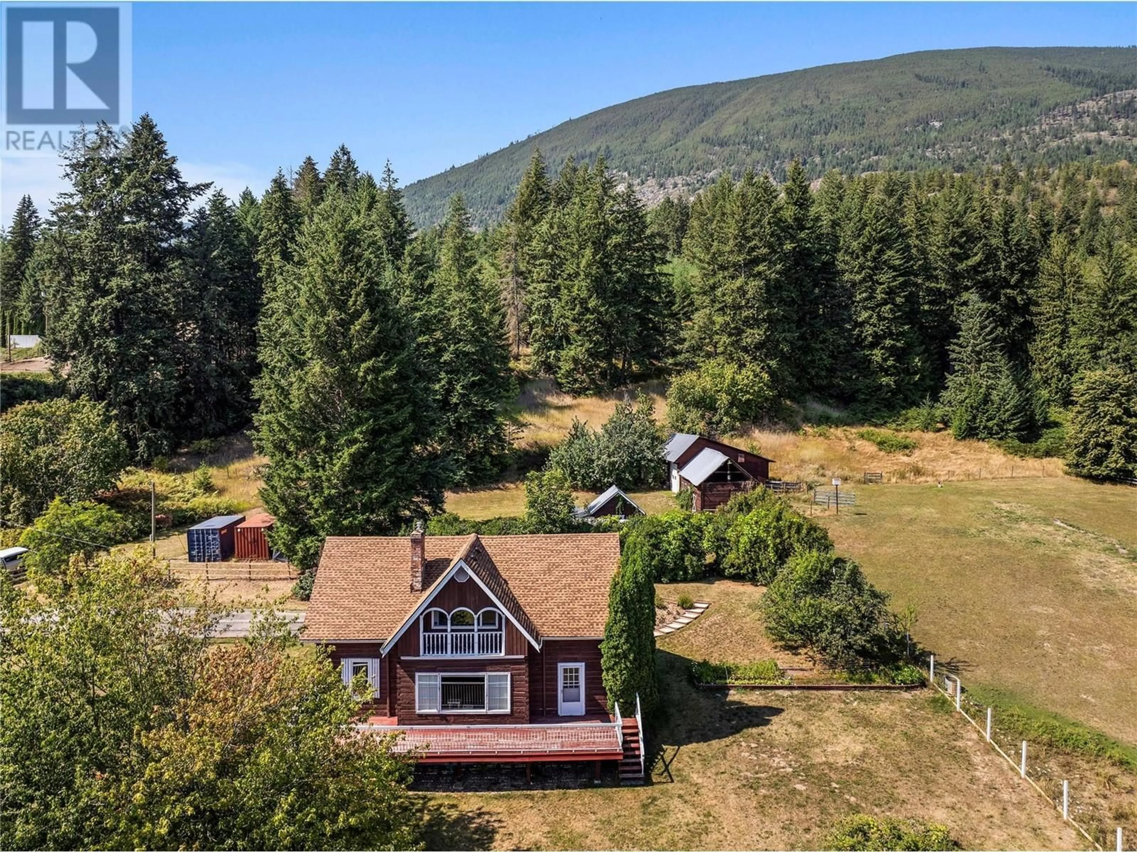 A pic from outside/outdoor area/front of a property/back of a property/a pic from drone, mountain view for 5931 40 Street NW, Salmon Arm British Columbia V1E3B6