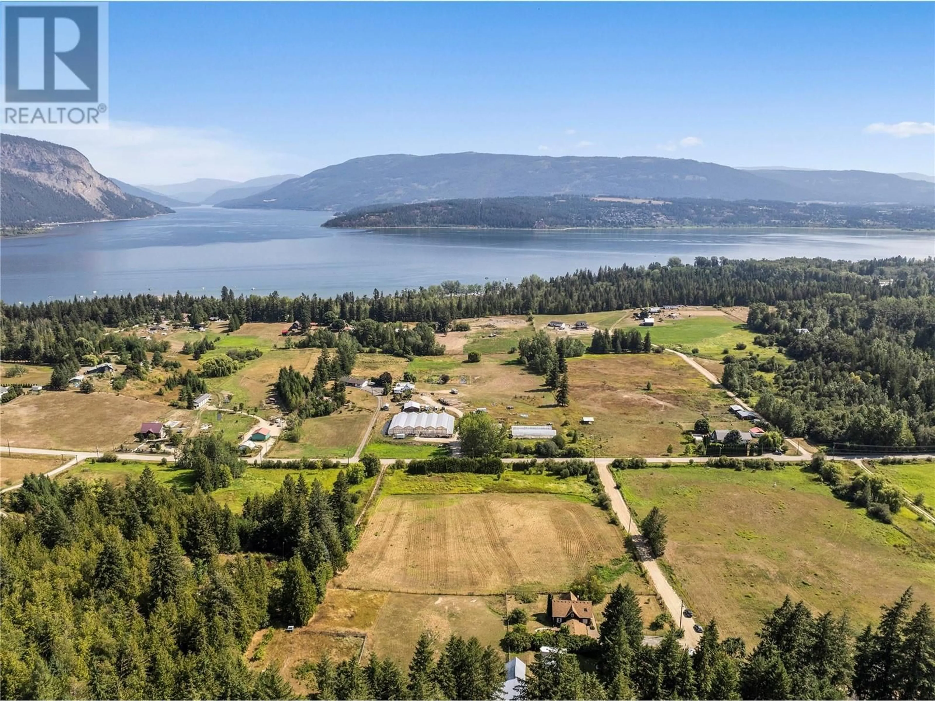 A pic from outside/outdoor area/front of a property/back of a property/a pic from drone, water/lake/river/ocean view for 5931 40 Street NW, Salmon Arm British Columbia V1E3B6