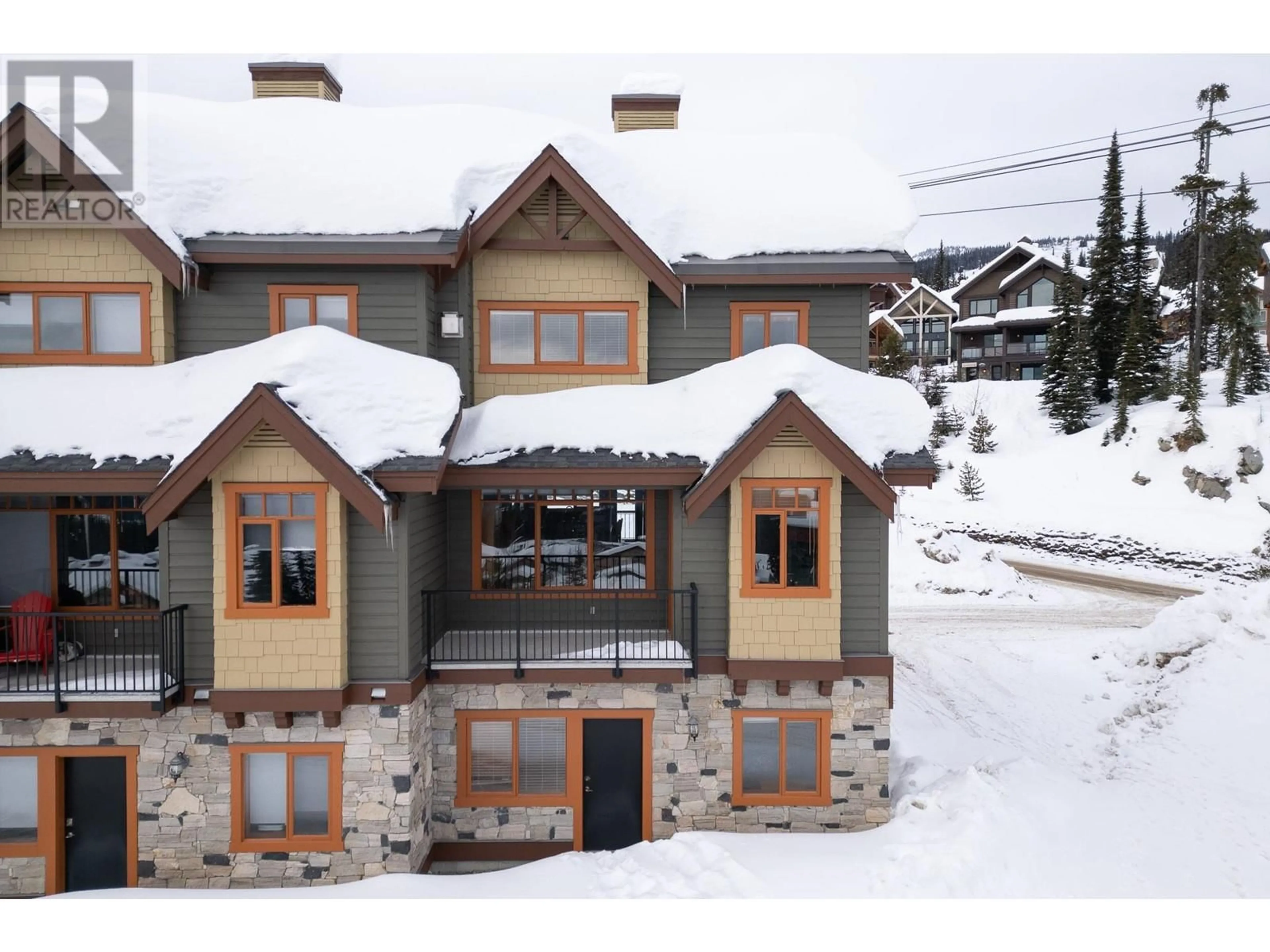 A pic from outside/outdoor area/front of a property/back of a property/a pic from drone, street for 310 Whitehorse Lane Unit# 1, Big White British Columbia V1P1P3