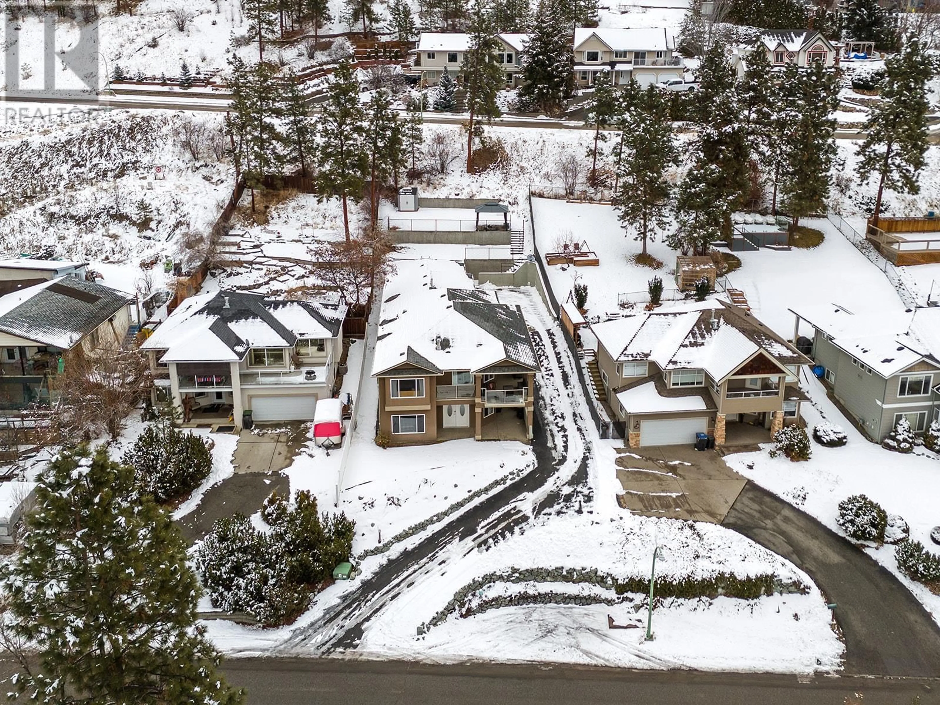 A pic from outside/outdoor area/front of a property/back of a property/a pic from drone, street for 1115 Bentien Road, Kelowna British Columbia V1X6R9