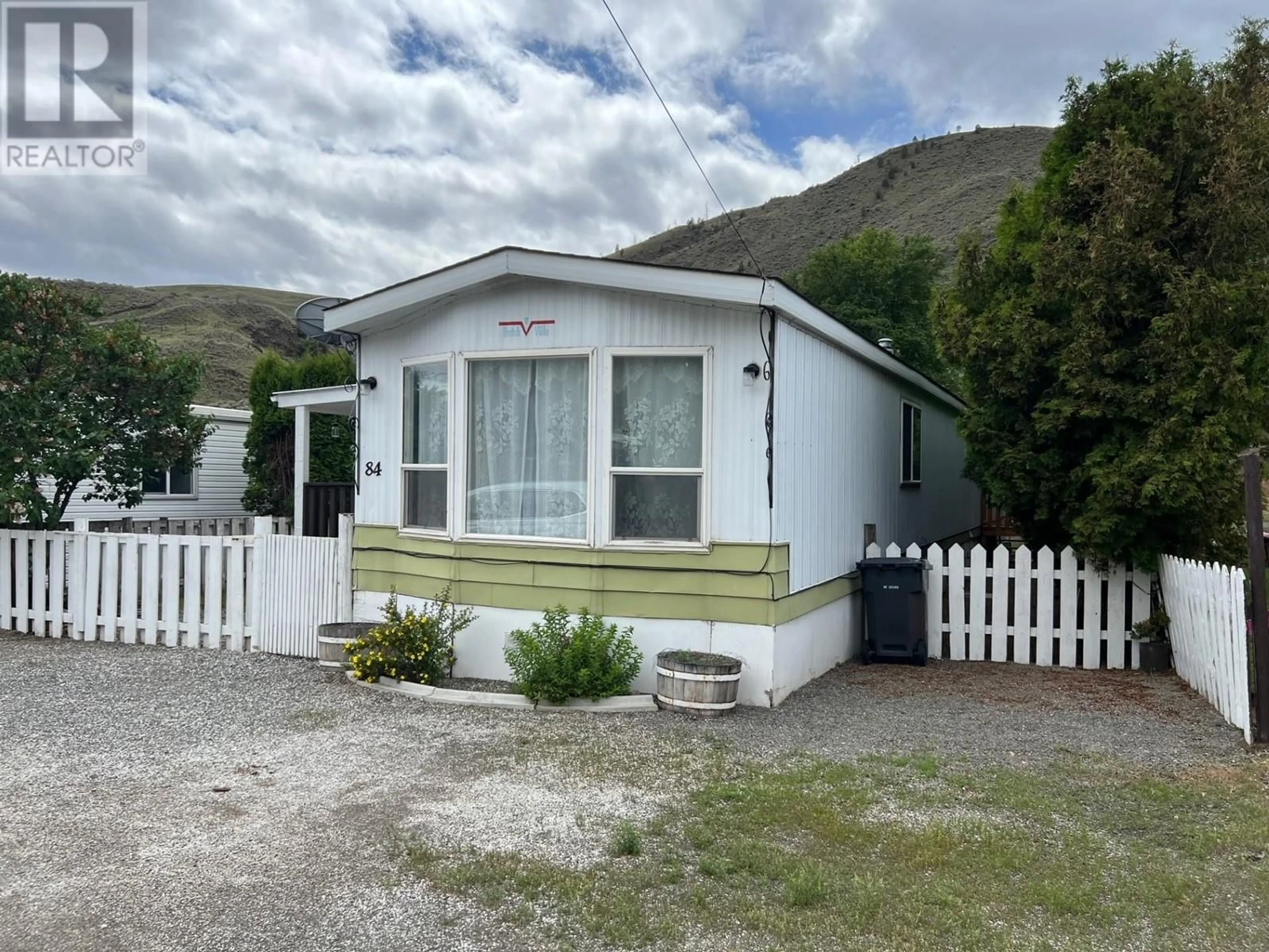 Home with vinyl exterior material, mountain view for 701 TRANS CANADA Highway Unit# 84, Cache Creek British Columbia V0K1H0