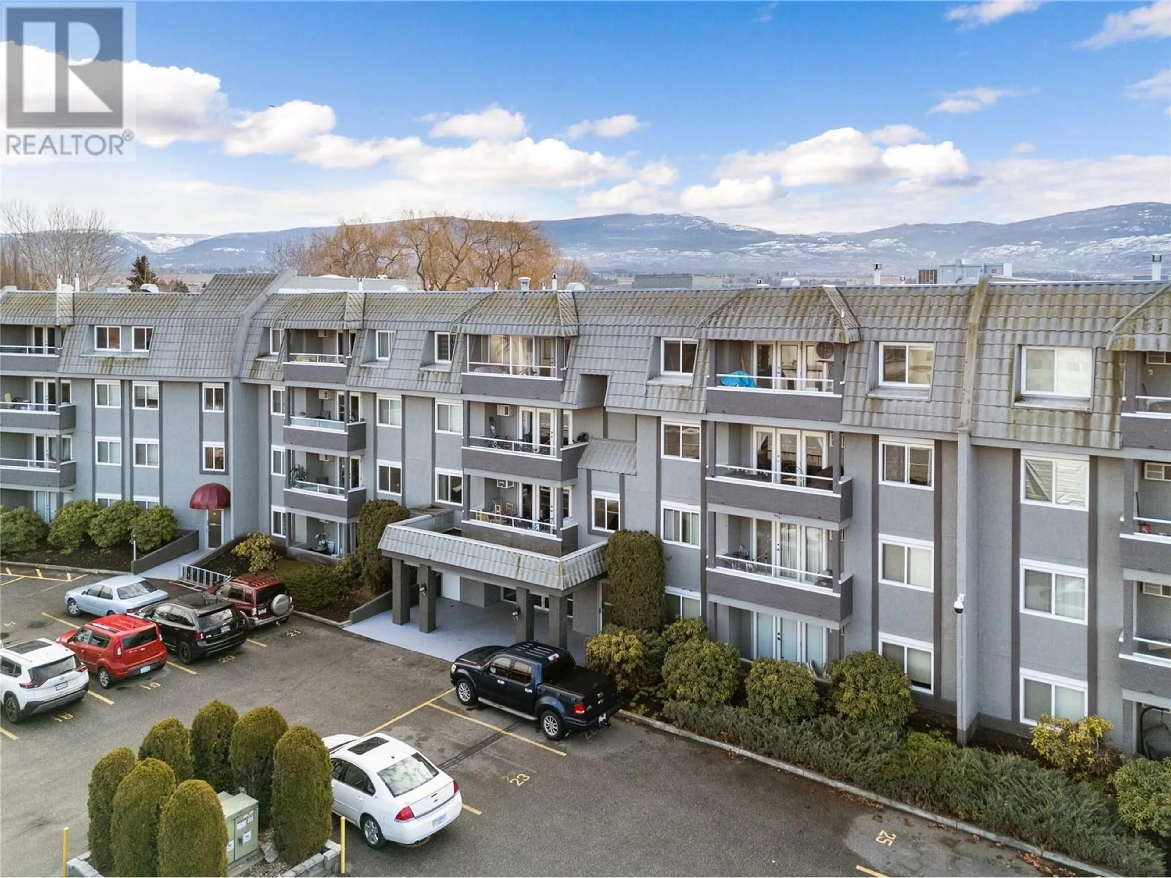 A pic from outside/outdoor area/front of a property/back of a property/a pic from drone, mountain view for 103 - 3175 DE MONTREUIL COURT, Kelowna British Columbia V1P1P4