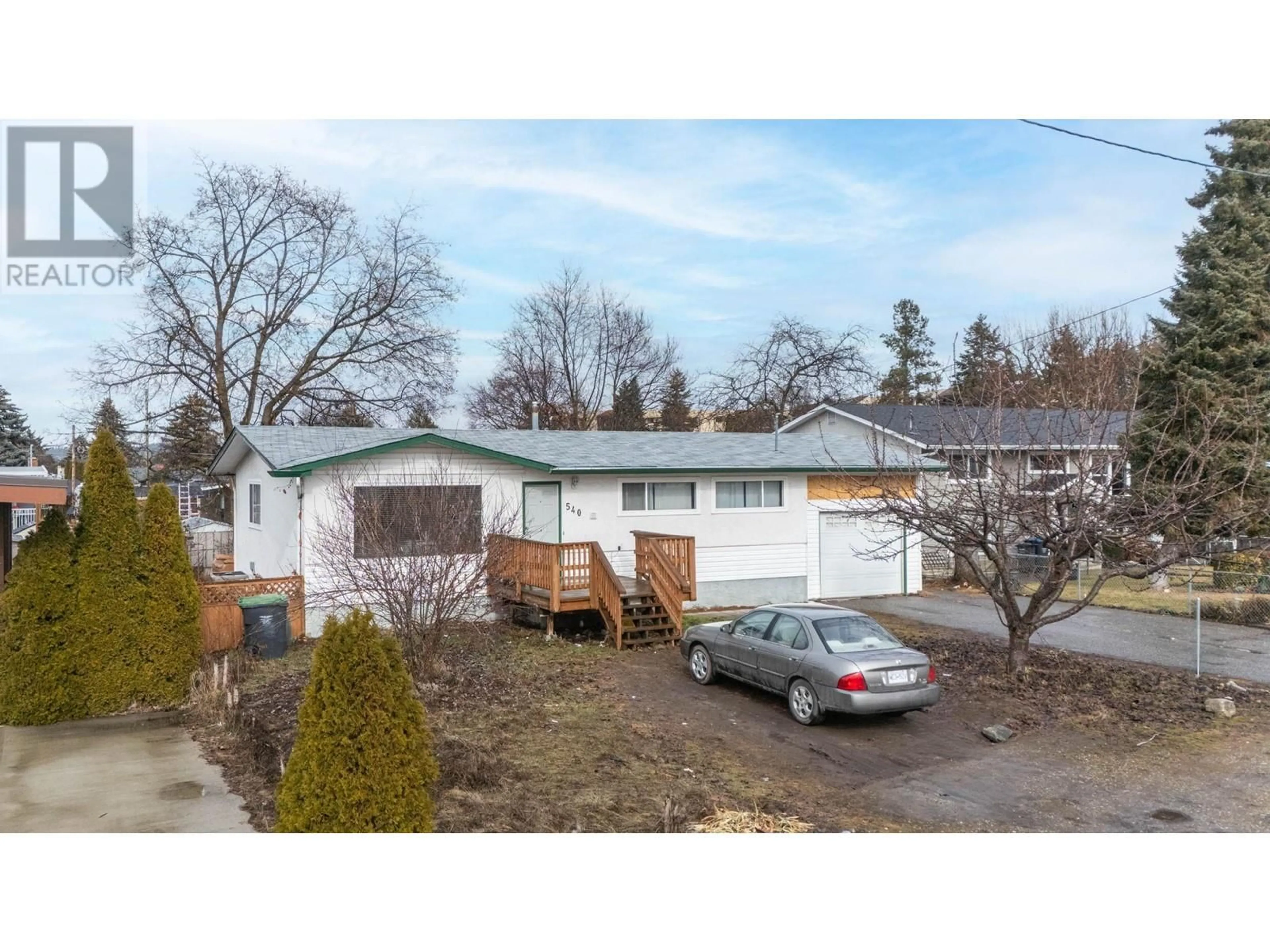 A pic from outside/outdoor area/front of a property/back of a property/a pic from drone, street for 540 Lomond Road, Kelowna British Columbia V1X1R8