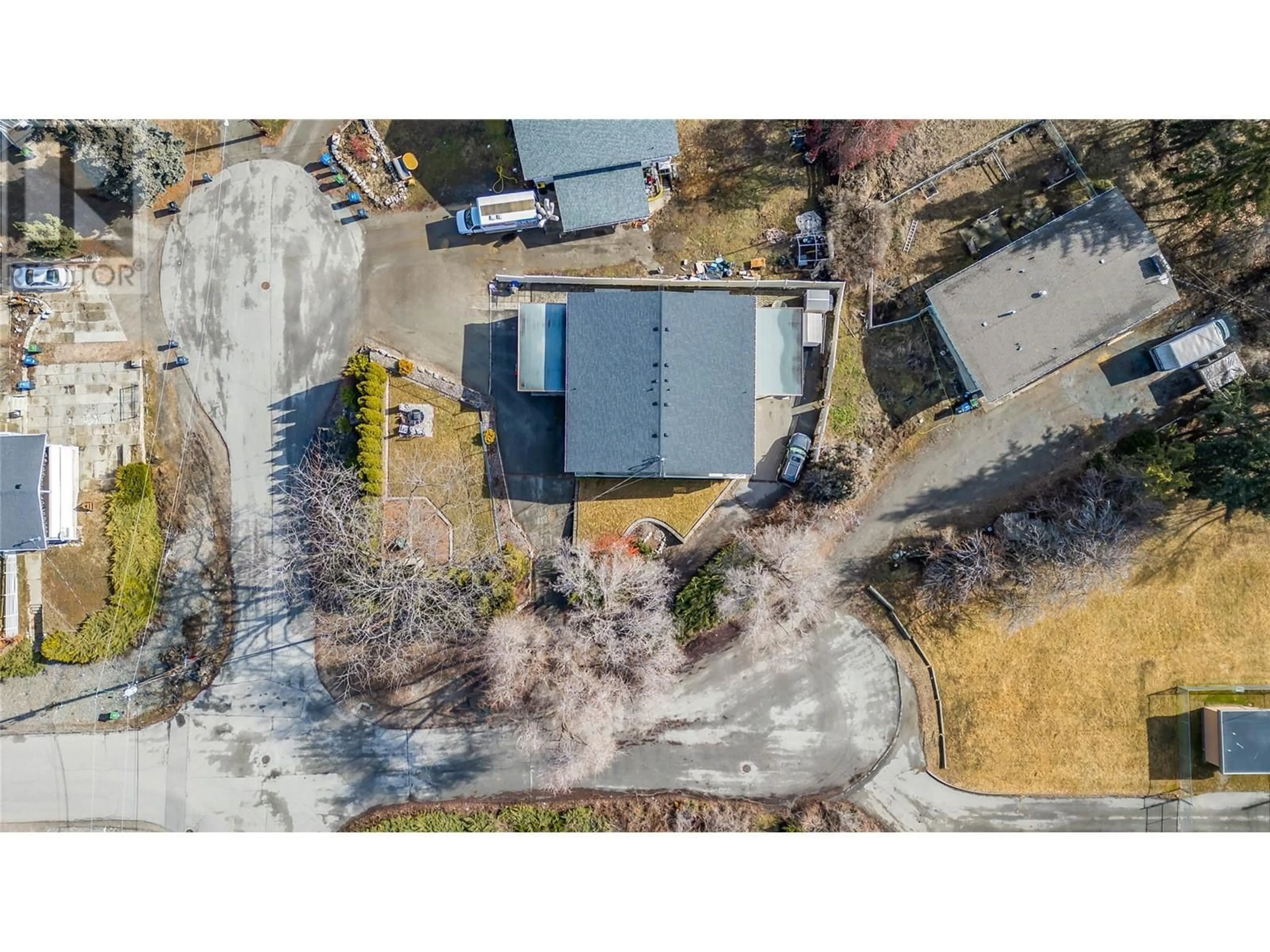 A pic from outside/outdoor area/front of a property/back of a property/a pic from drone, street for 1107 Cactus Road, Kelowna British Columbia V1X3N3