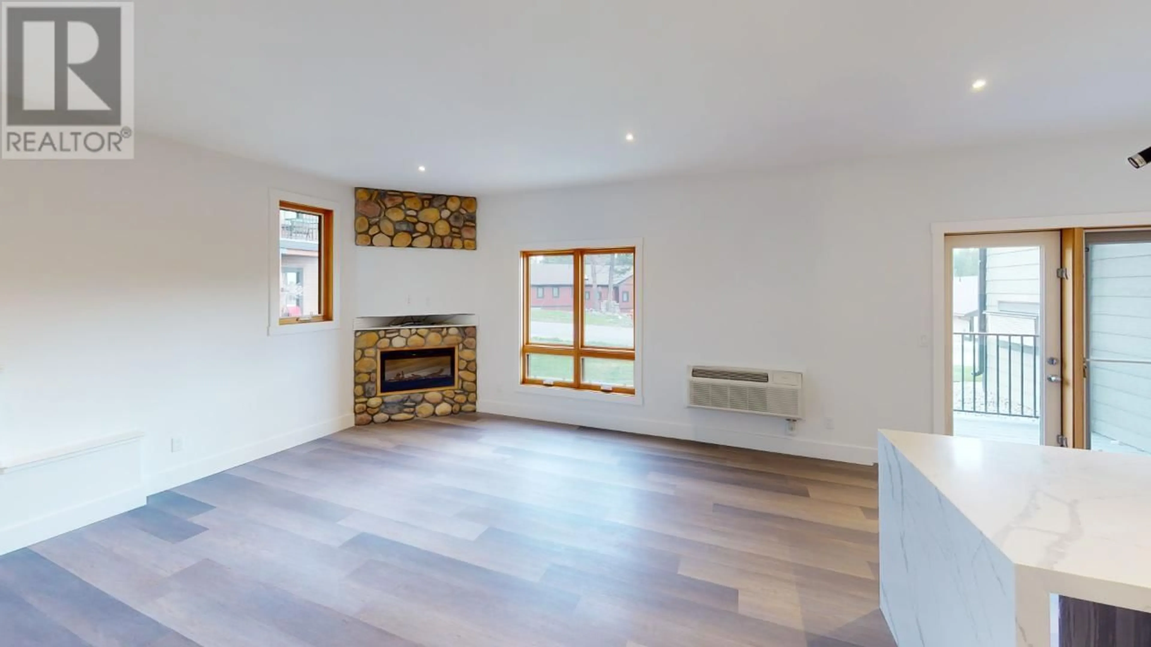 Living room with furniture, wood/laminate floor for 7291 Prospector Avenue Unit# 601, Radium Hot Springs British Columbia V0A1M0